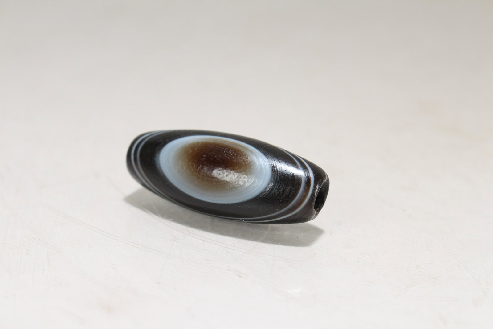 A Tibetan Religious Fortune Bead: A Tibetan Religious Fortune Bead. Length: 1.75 (inch).