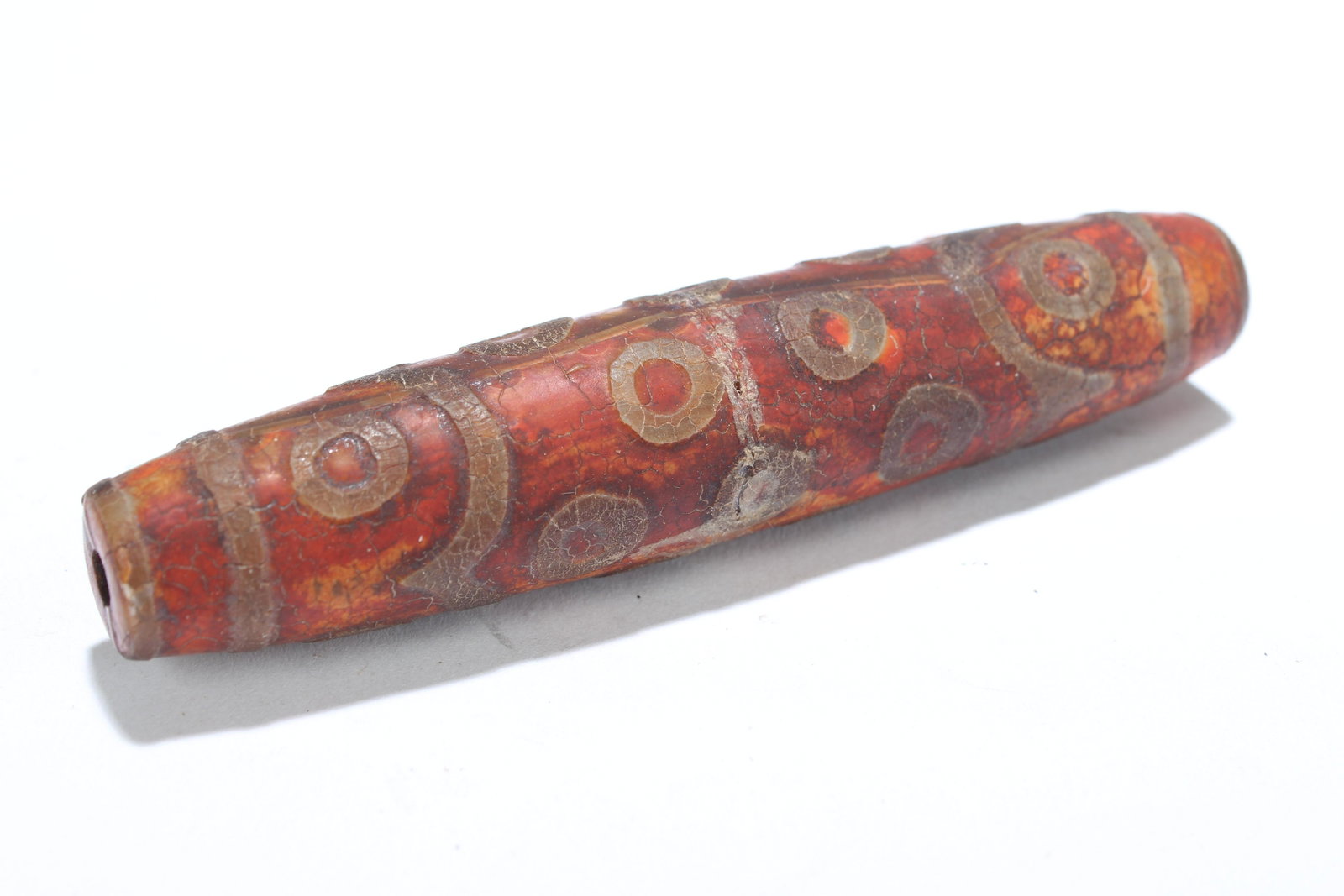 A Tibetan Religious Dzi Bead: A Tibetan Religious Dzi Bead . Length: 4 (inch).