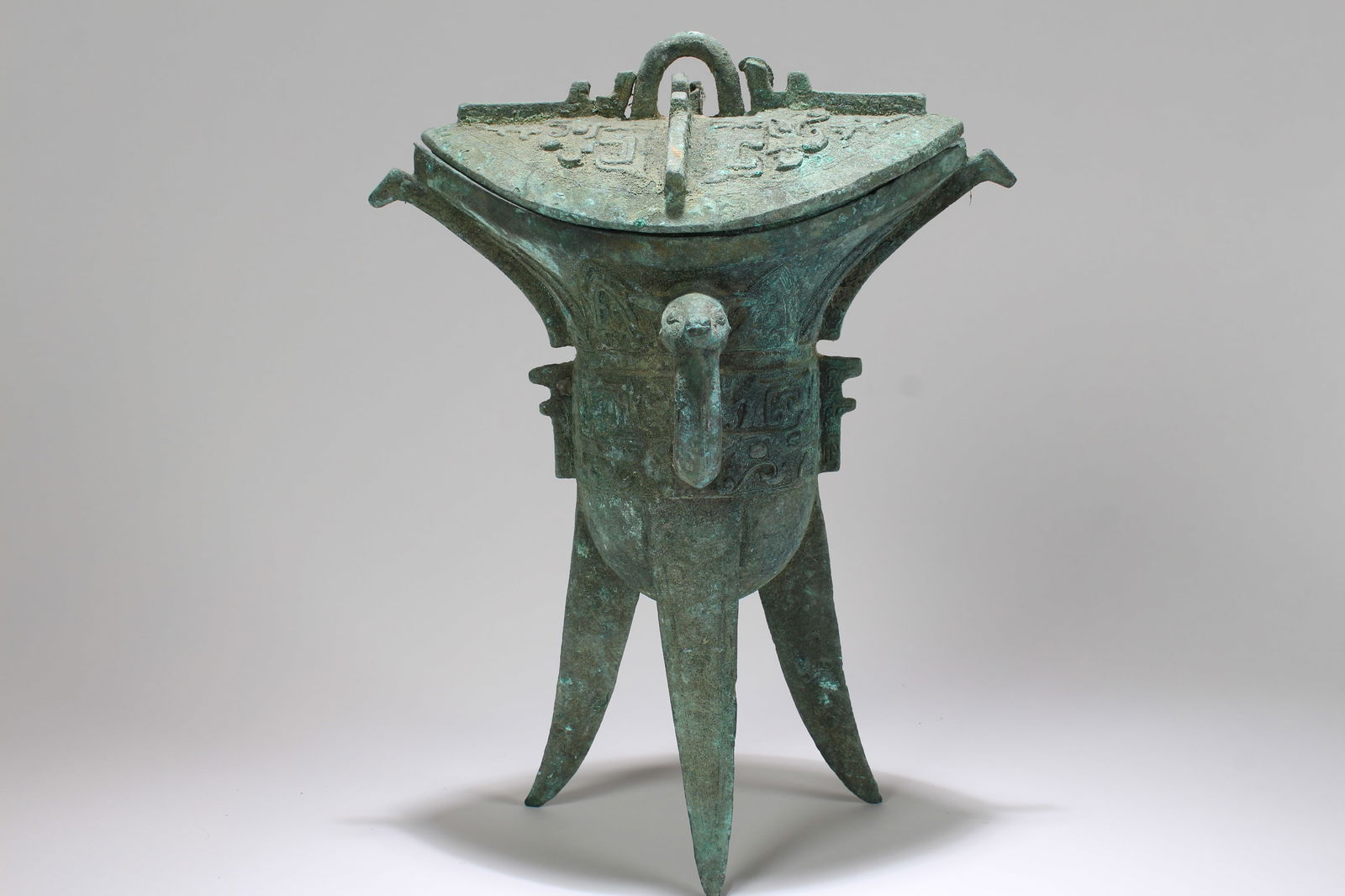 A Chinese Ancient-framing Lidded Fortune Tri-podded Bronze Vessel (1 of 5)