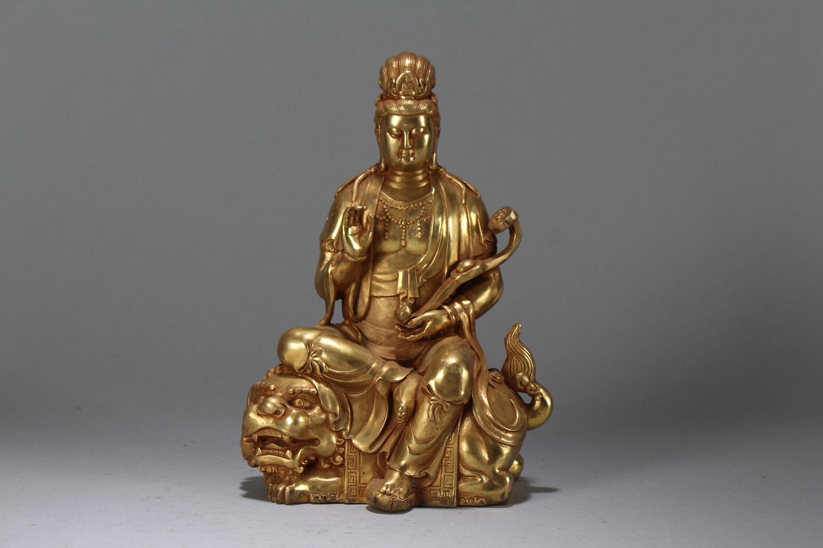 A Chinese Religious Vividly-detailed Gilt Fortune Buddha Statue: A Chinese Religious Vividly-detailed Gilt Fortune Buddha Statue. Height : 8.1 (inch). Width : 6.1 (inch). Length : 3.5 (inch).