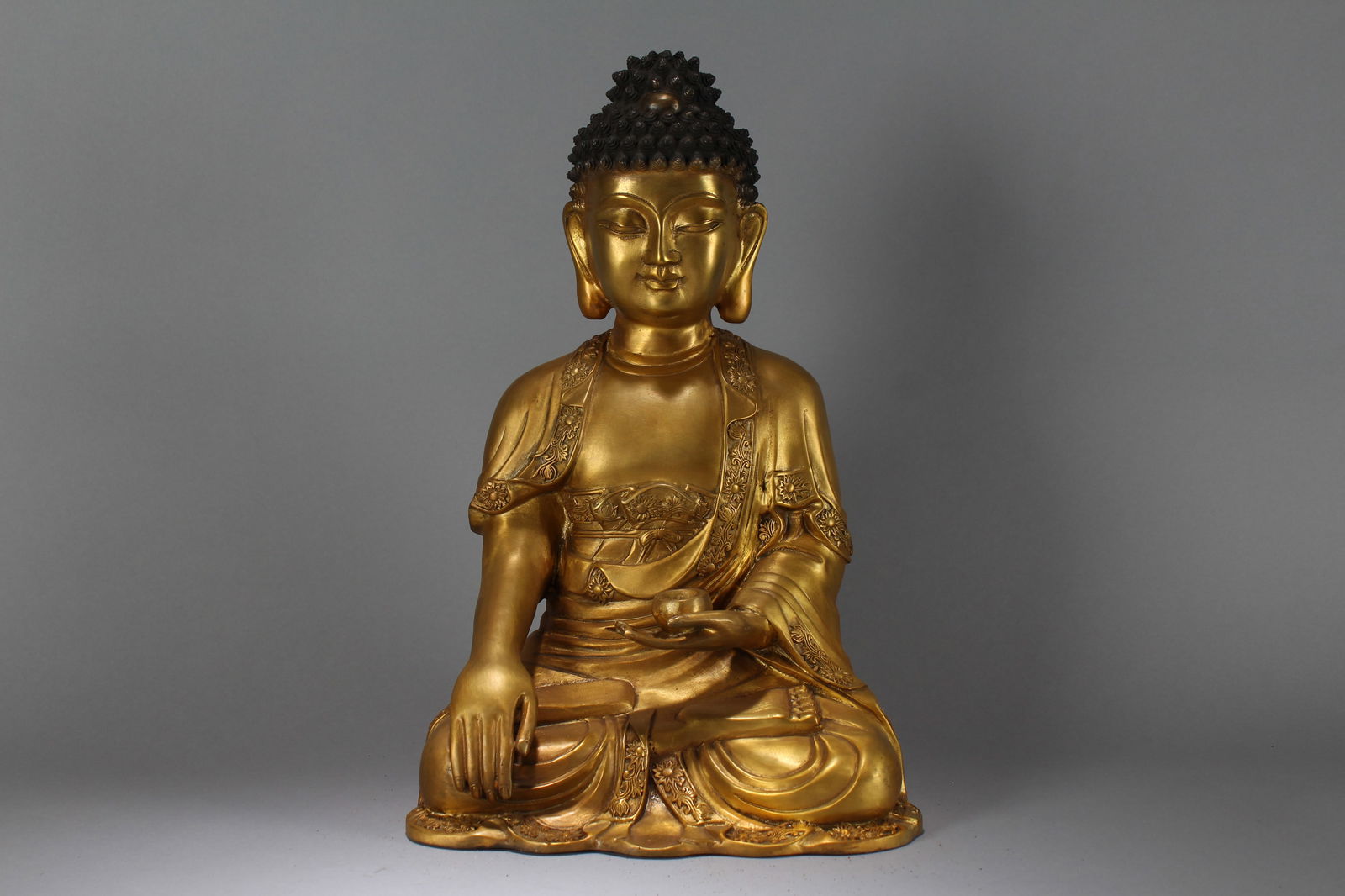 A Chinese Gilt Pondering-pouse Religious Fortune Massive Buddha Statue: A Chinese Gilt Pondering-pouse Religious Fortune Massive Buddha Statue. Height: 16 (inch). Width: 12 (inch). Length: 8 (inch).