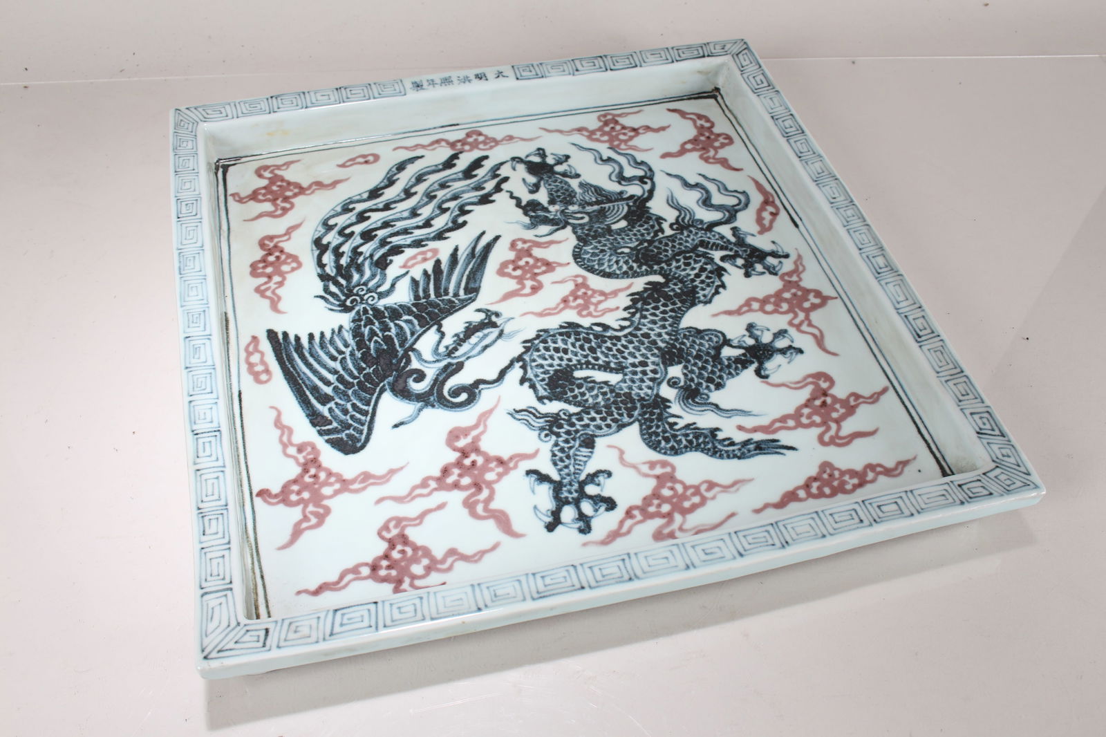 A Chinese Phoenix-fortune Square-based Porcelain Fortune Plate: A Chinese Phoenix-fortune Square-based Porcelain Fortune Plate. Height: 1.25 (inch). Length: 16 (inch). Width: 16 (inch).