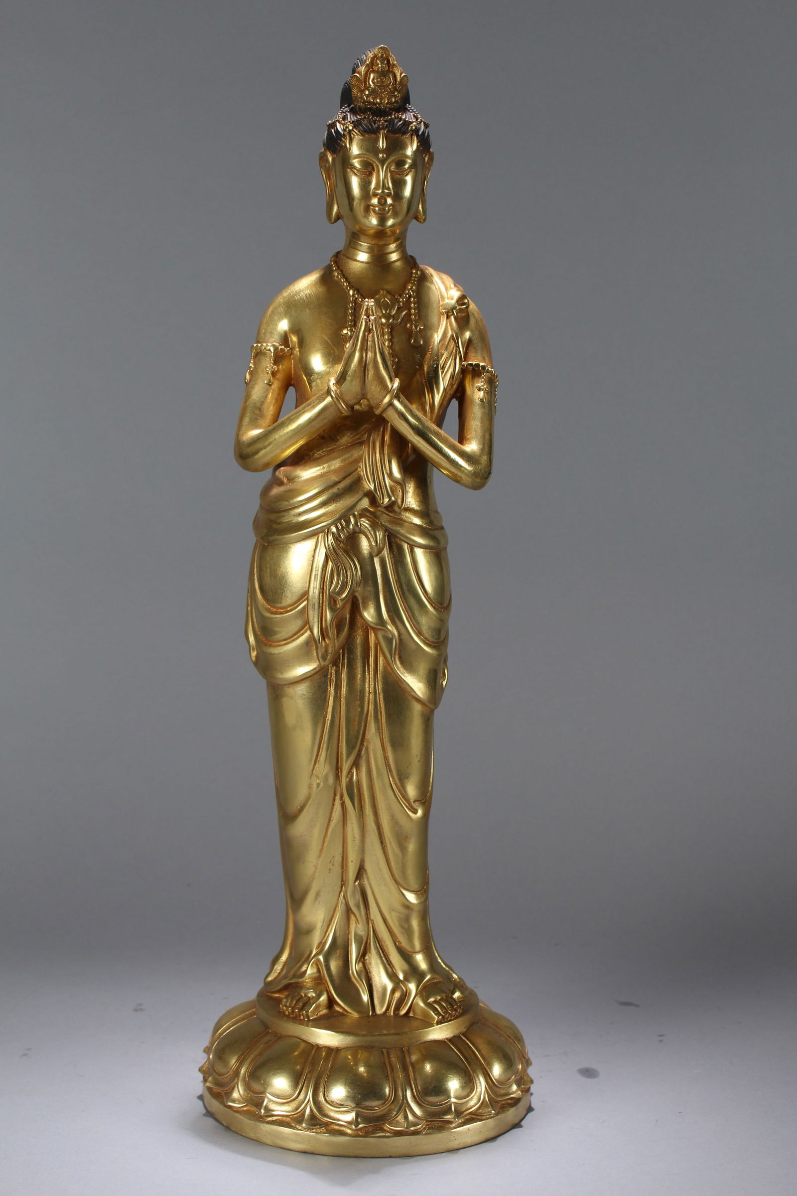 A Chinese Vividly-detailed Gilt Religious Fortune Massive Buddha Statue: A Chinese Vividly-detailed Gilt Religious Fortune Massive Buddha Statue. Height: 20 (inch). Width: 6.5 (inch)