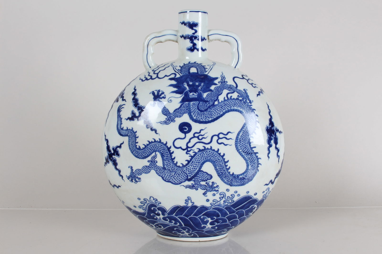 A Chinese Duo-handled Dragon-decorating Blue and White Porcelain Fortune Vase: A Chinese Duo-handled Dragon-decorating Blue and White Porcelain Fortune Vase . Height: 14 (inch).
