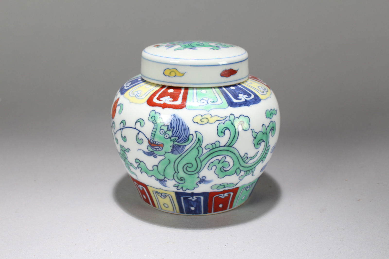 A Chinese Lidded Myth-beast Porcelain Fortune Jar: A Chinese Lidded Myth-beast Porcelain Fortune Jar. Height: 5 (inch). Width: 5.25 (inch).