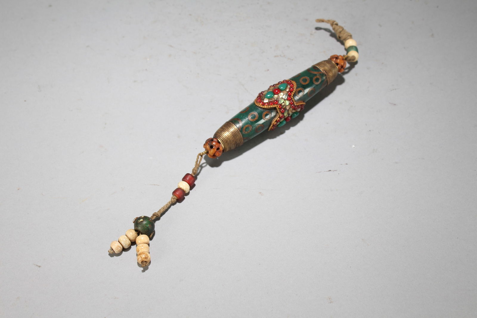 A Tibetan Fortune Bead: A Tibetan Fortune Bead. Height : 1.1 (inch). Width : 11 (inch). Length : 1 (inch).