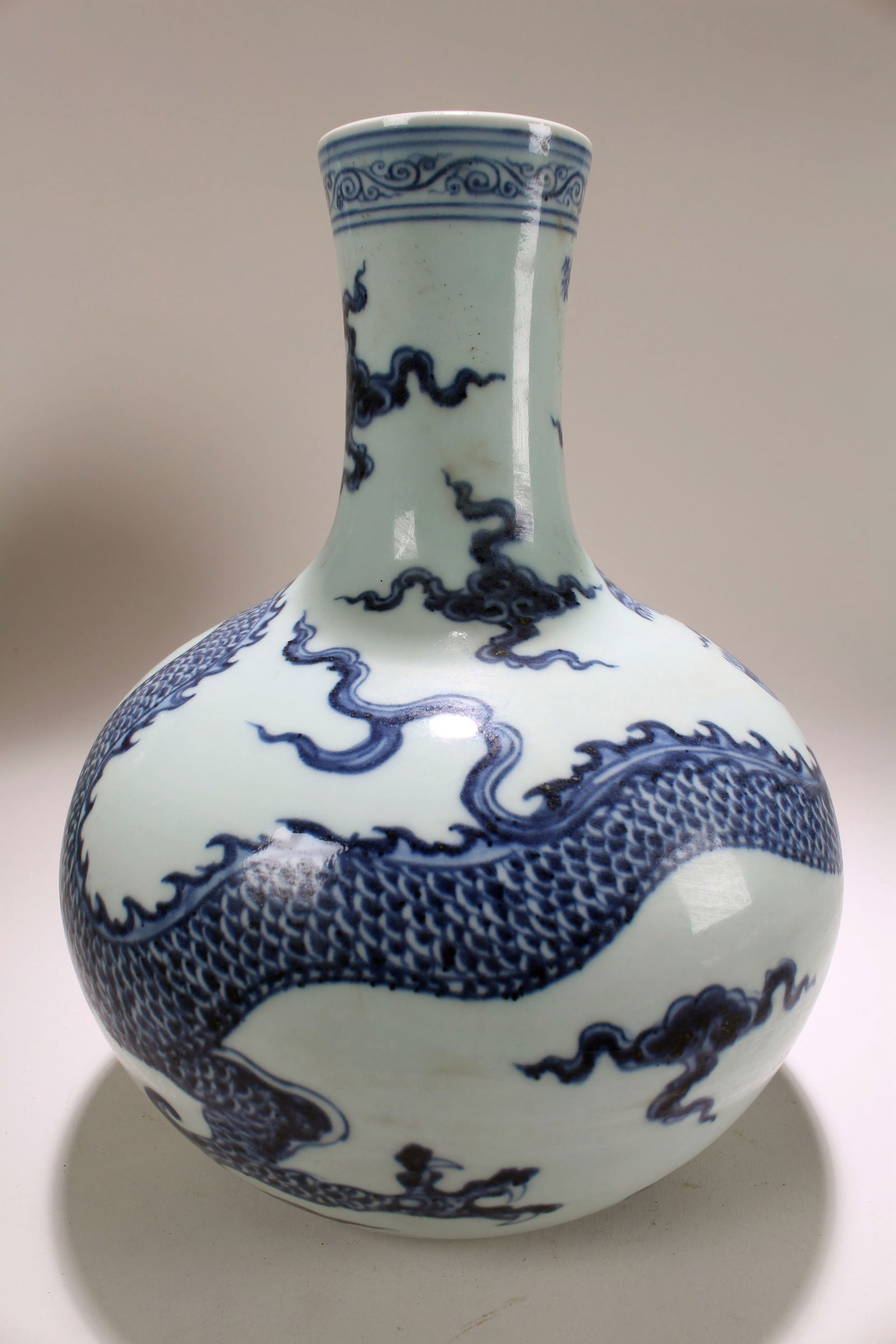 A Chinese Blue and White Dragon-decorating Porcelain Fortune Vase: A Chinese Blue and White Dragon-decorating Porcelain Fortune Vase . Height: 10(inch). Width: 8 (inch).