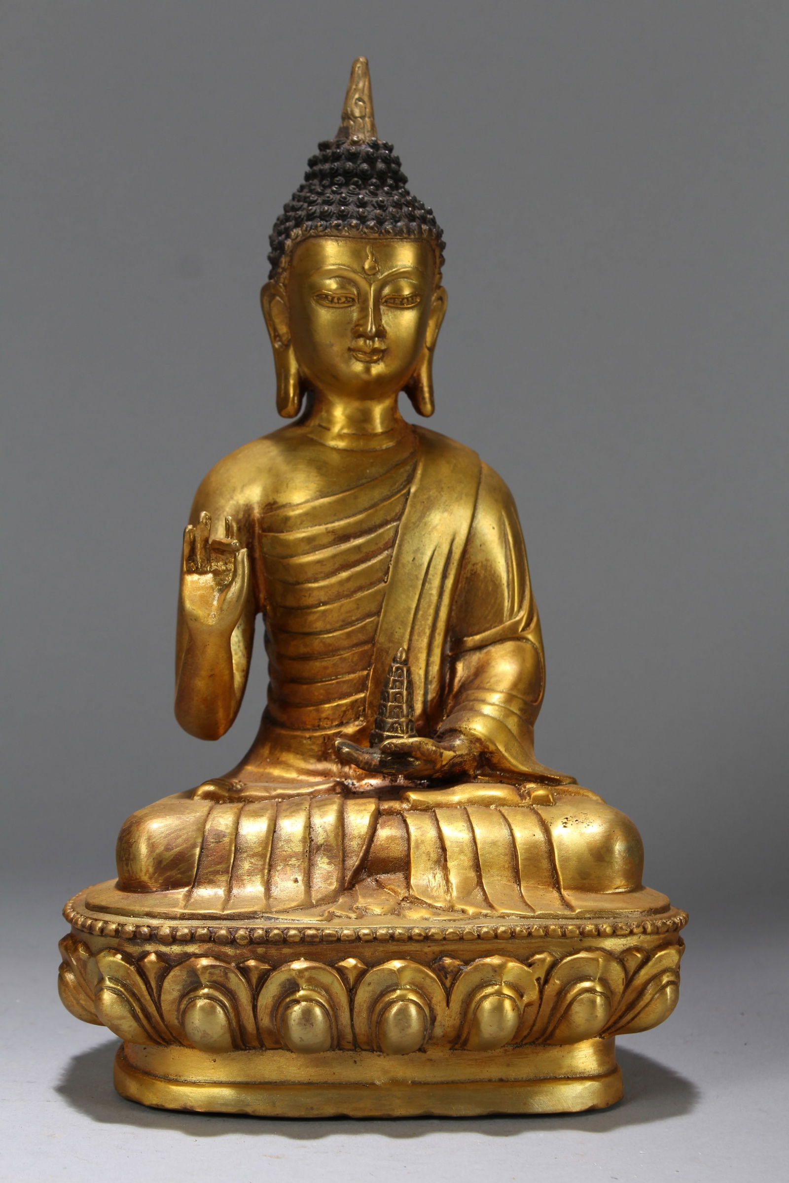 A Chinese Vividly-detailed Religious Lotus-framing Gilt Fortune Buddha Statue: A Chinese Vividly-detailed Religious Lotus-framing Gilt Fortune Buddha Statue. Height: 11.75 (inch). Length: 6.75 (inch). Width: 4.75 (inch).