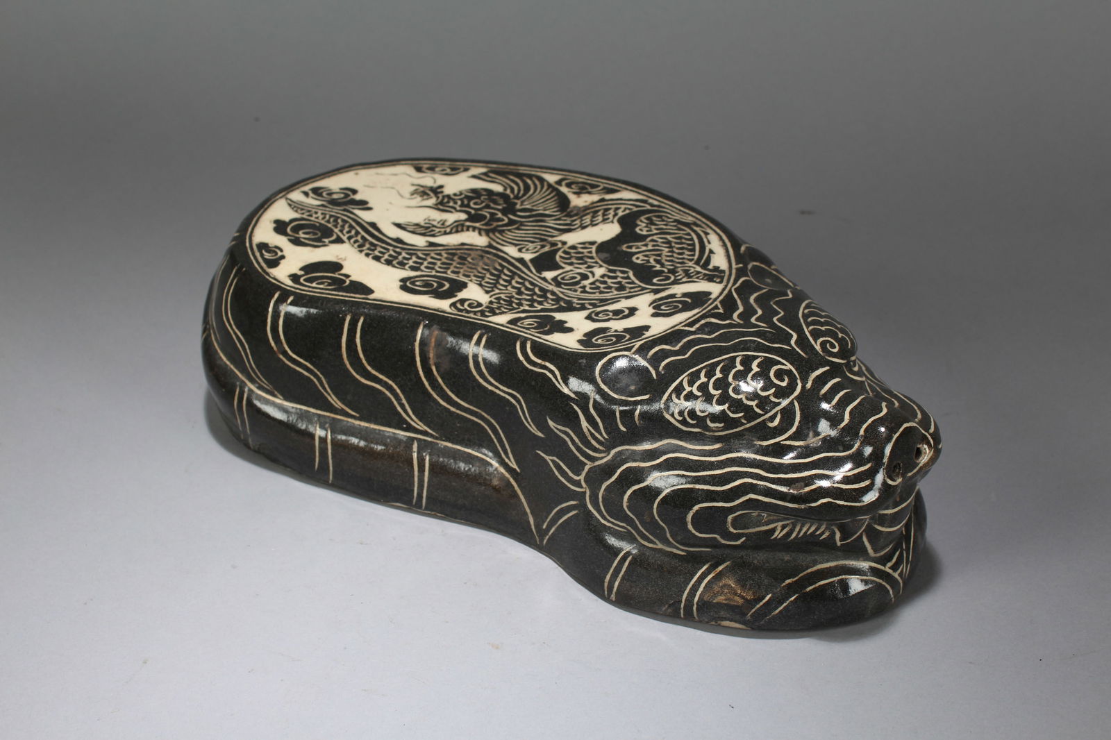 A Chinese Myth-beast Religious Porcelain Fortune Statue: A Chinese Myth-beast Religious Porcelain Fortune Statue. Height: 3 (inch). Width: 12 (inch). Length: 6 (inch).