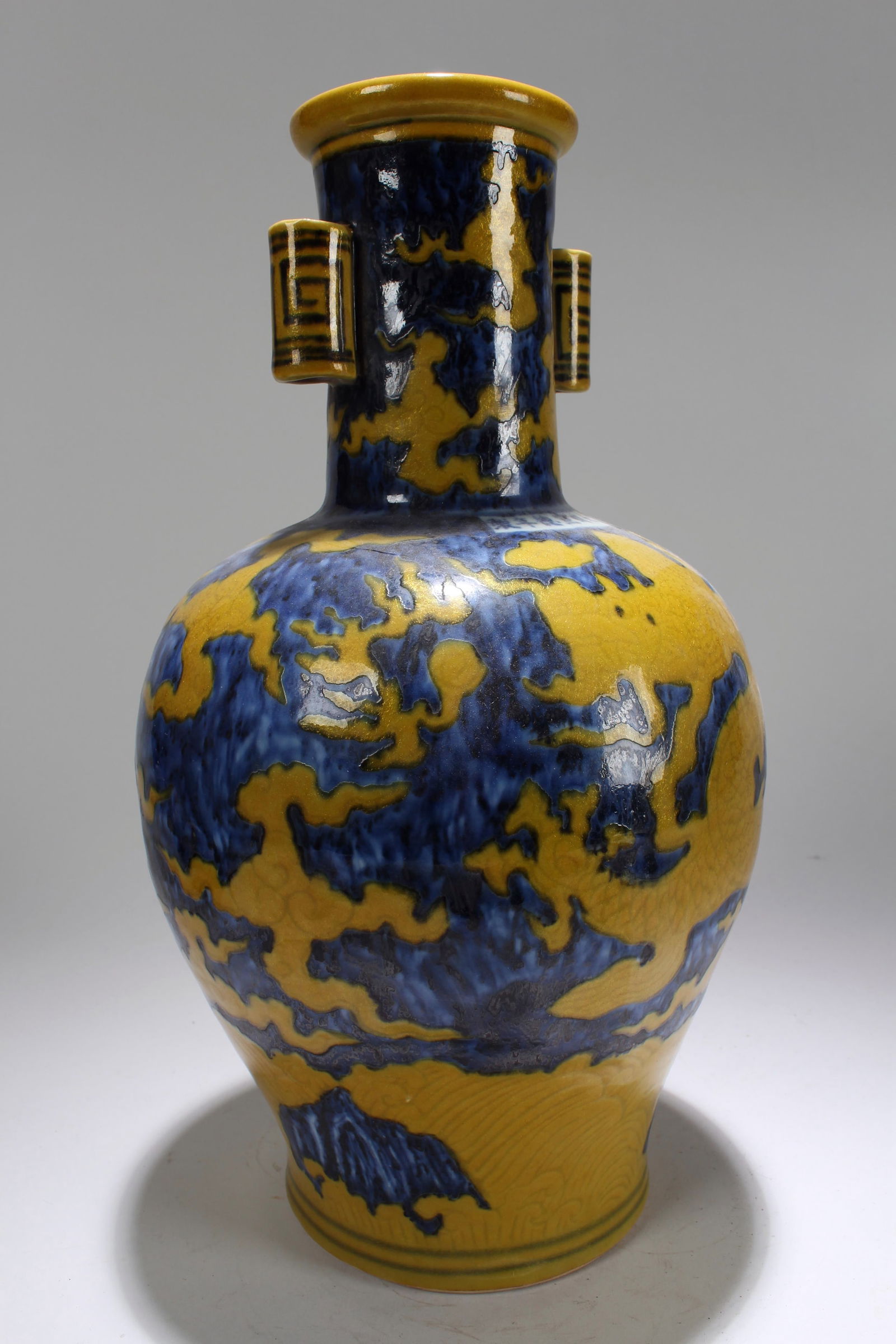 A Chinese Yellow-coding Duo-handled Dragon-decorating Porcelain Vase (1 of 4)