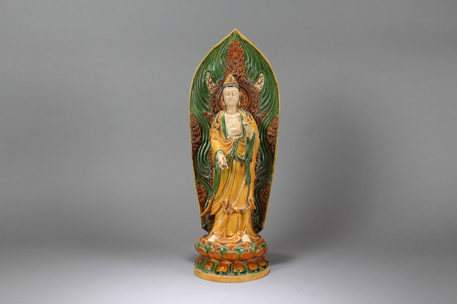 A Chinese Standing-still Religious Porcelain Buddha Statue: A Chinese Standing-still Pondering-pose Gilt Fortune Buddha Statue. Height: 17 (inch). Opening Diameter: 5.5 (inch)