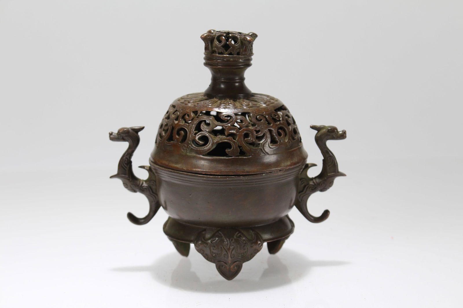 A Chinese Duo-handling Tri-podded Lidded Fortune Censer: A Chinese Duo-handling Tri-podded Lidded Fortune Censer. Height: 4.75 (inch). Length: 4.75 (inch).