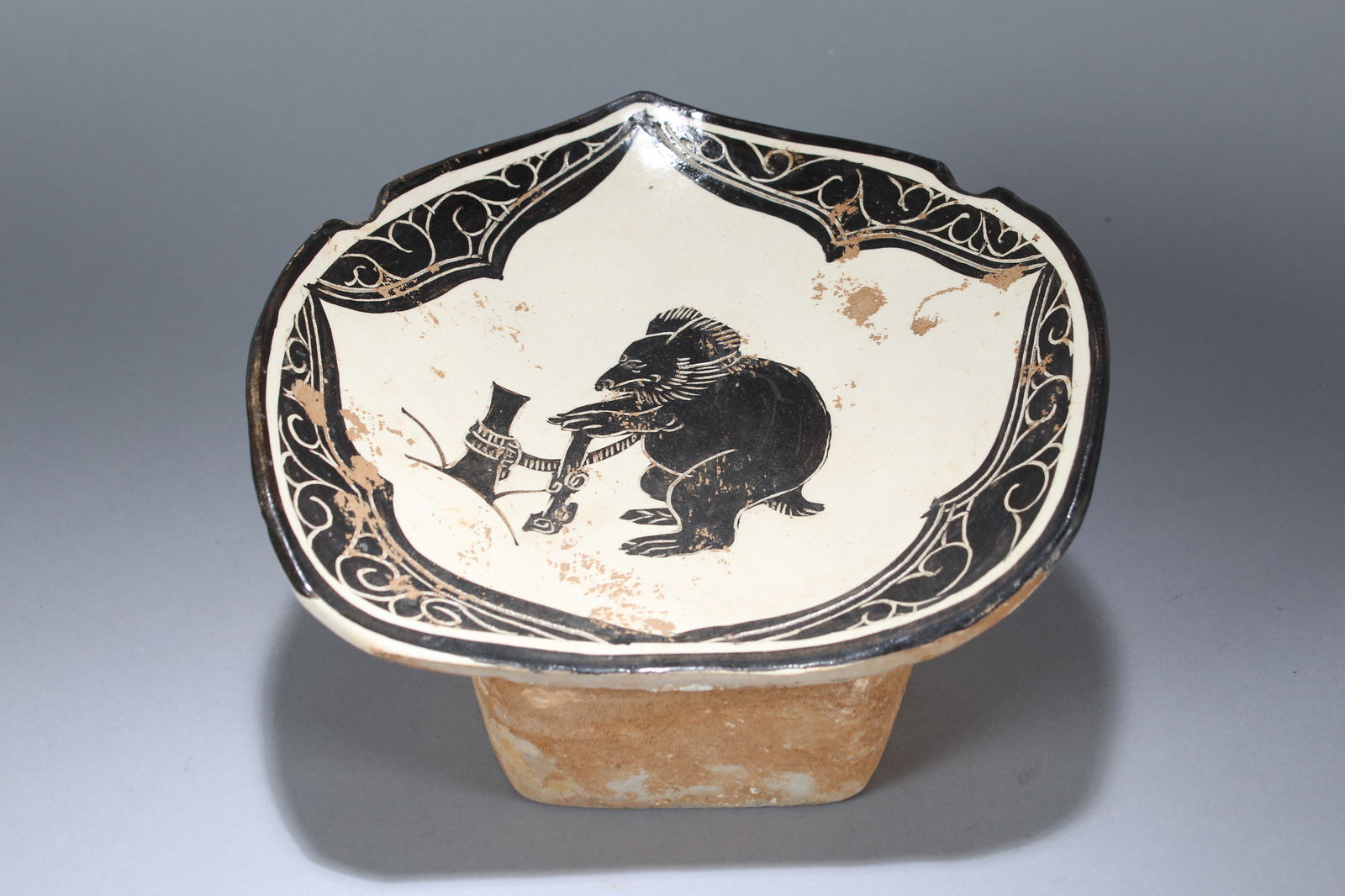 A Chinese Religious Porcelain Fortune Pillow Stand: A Chinese Religious Porcelain Fortune Pillow Stand. Height: 5.5 (inch). Width: 9 (inch). Length: 9.75 (inch)