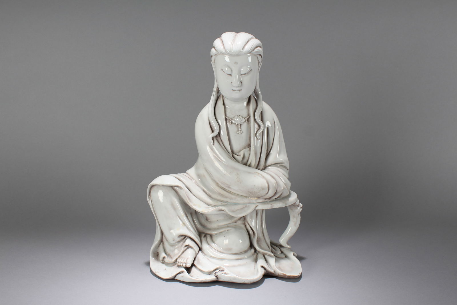 A Chinese Religious Porcelain Fortune Buddha Statue (1 of 5)