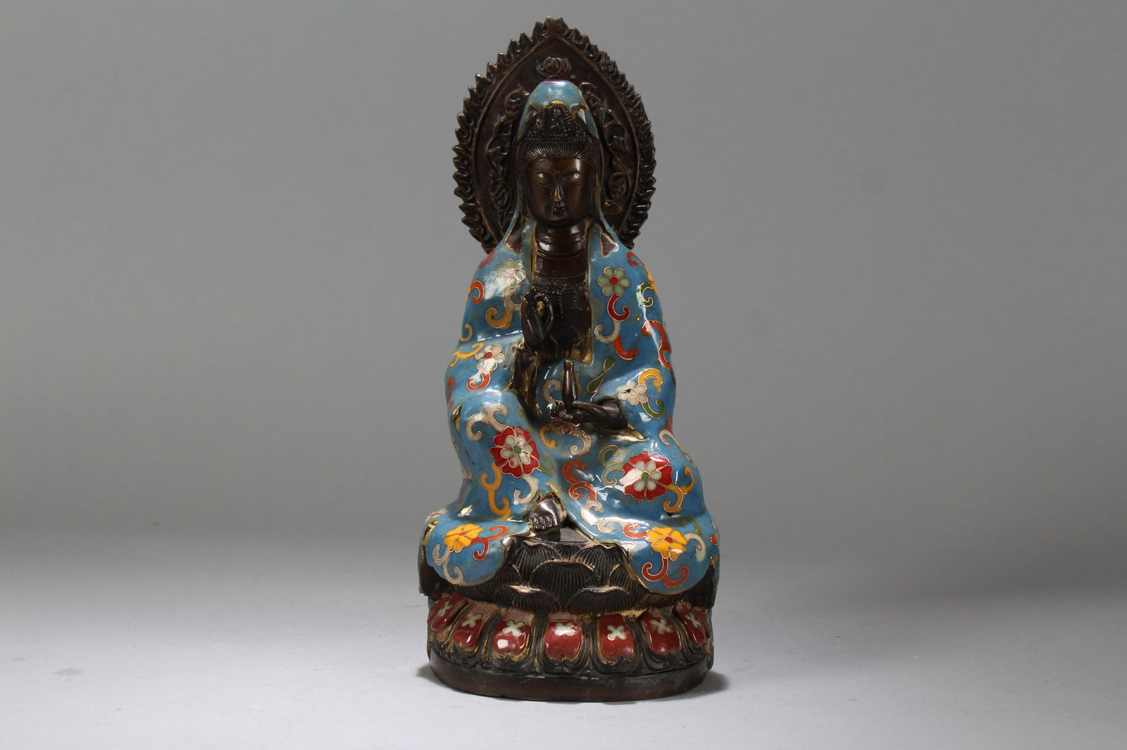 A Chinese Cloisonne Bat-framing Religious Fortune Buddha Statue: A Chinese Cloisonne Bat-framing Religious Fortune Buddha Statue. Height: 10.25 (inch). Length: 4.5 (inch). Width: 3.5 (inch).