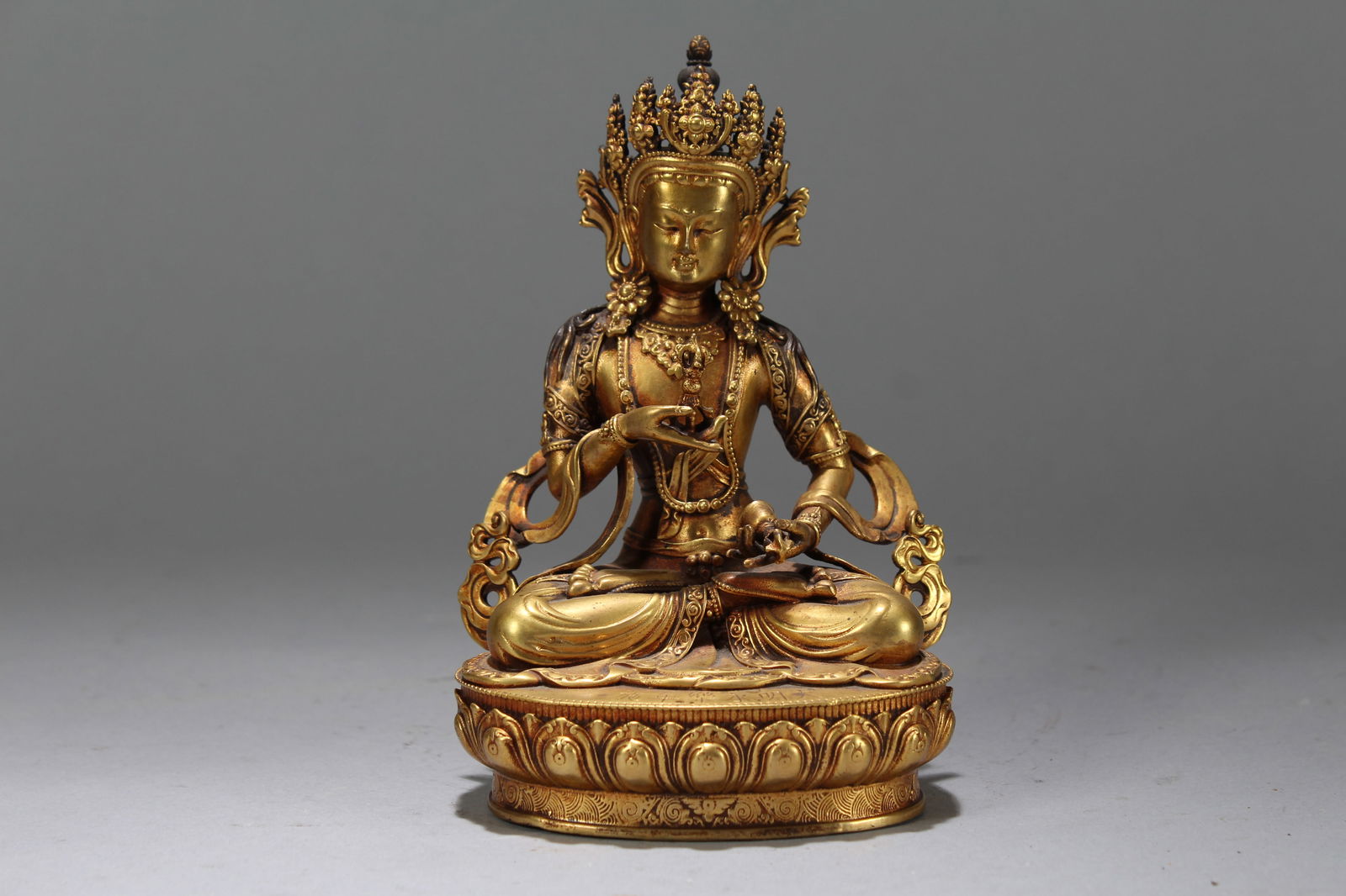 A Chinese Gilt Vividly-detailed Religious Fortune Buddha Statue: A Chinese Gilt Vividly-detailed Religious Fortune Buddha Statue. Height: 5.75 (inch). Width: 3.75 (inch). Length: 3 (inch).