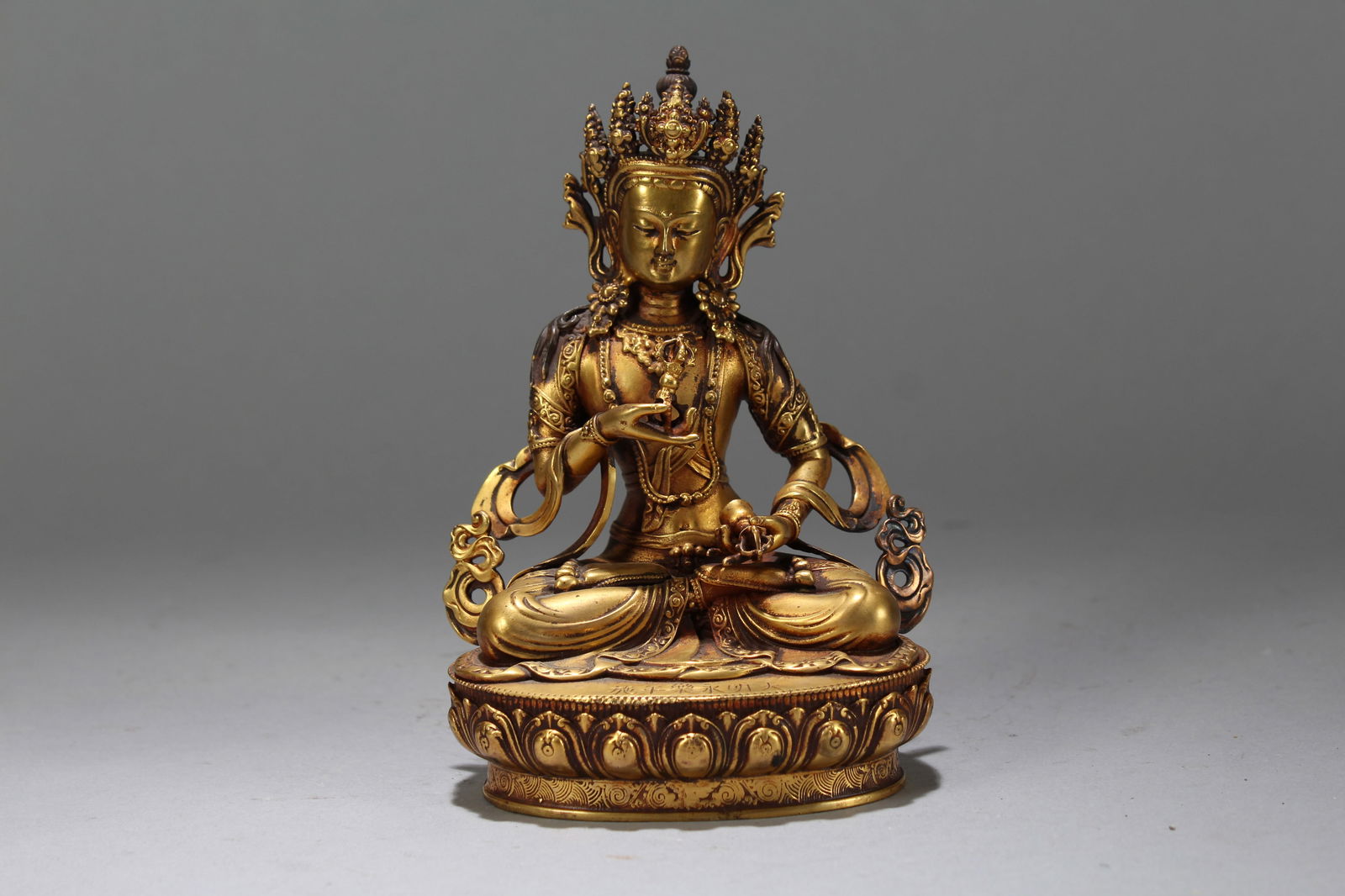 A Chinese Gilt Vividly-detailed Religious Fortune Buddha Statue: A Chinese Gilt Vividly-detailed Religious Fortune Buddha Statue. Height: 5.75 (inch). Width: 4 (inch). Length: 3 (inch).