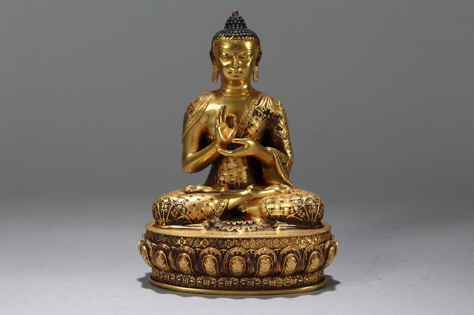 A Chinese Gilt Vividly-detailed Religious Fortune Buddha Statue: A Chinese Gilt Vividly-detailed Religious Fortune Buddha Statue. Height: 5.75 (inch). Width: 4.25 (inch). Length: 3 (inch).