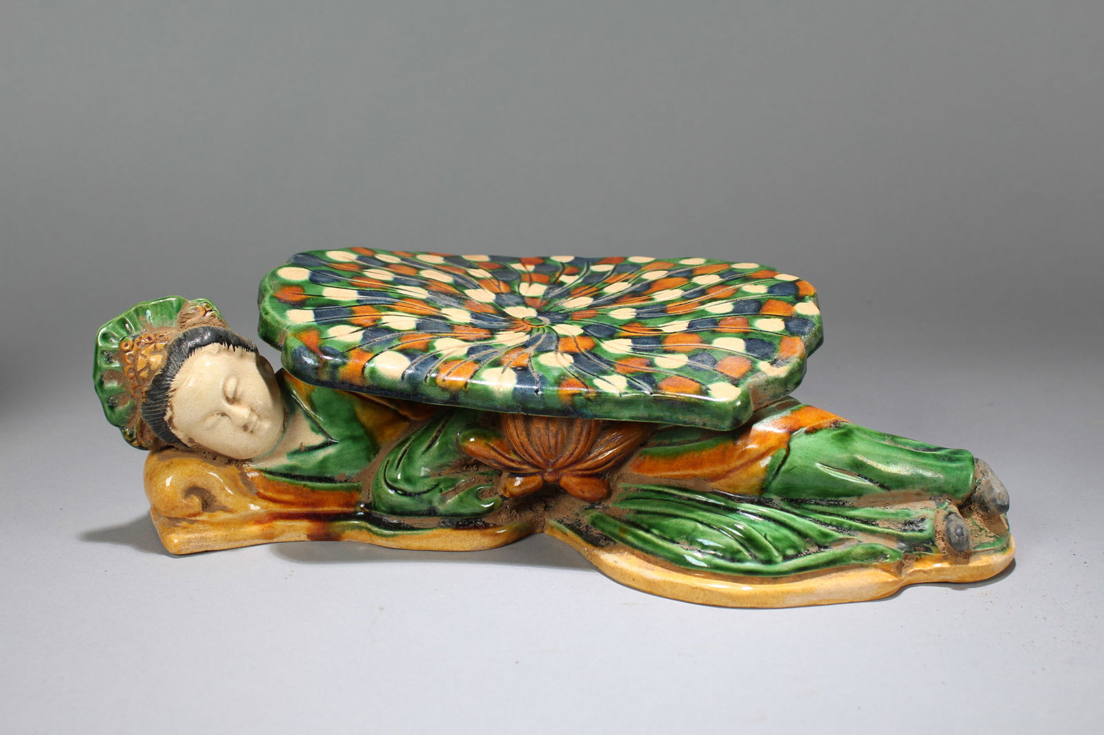 A Chinese Religious Tri-colored-framing Fortune Porcelain Statue: A Chinese Religious Tri-colored-framing Fortune Porcelain Statue. Height: 3 (inch). Width: 5 (inch). Length: 13 (inch).