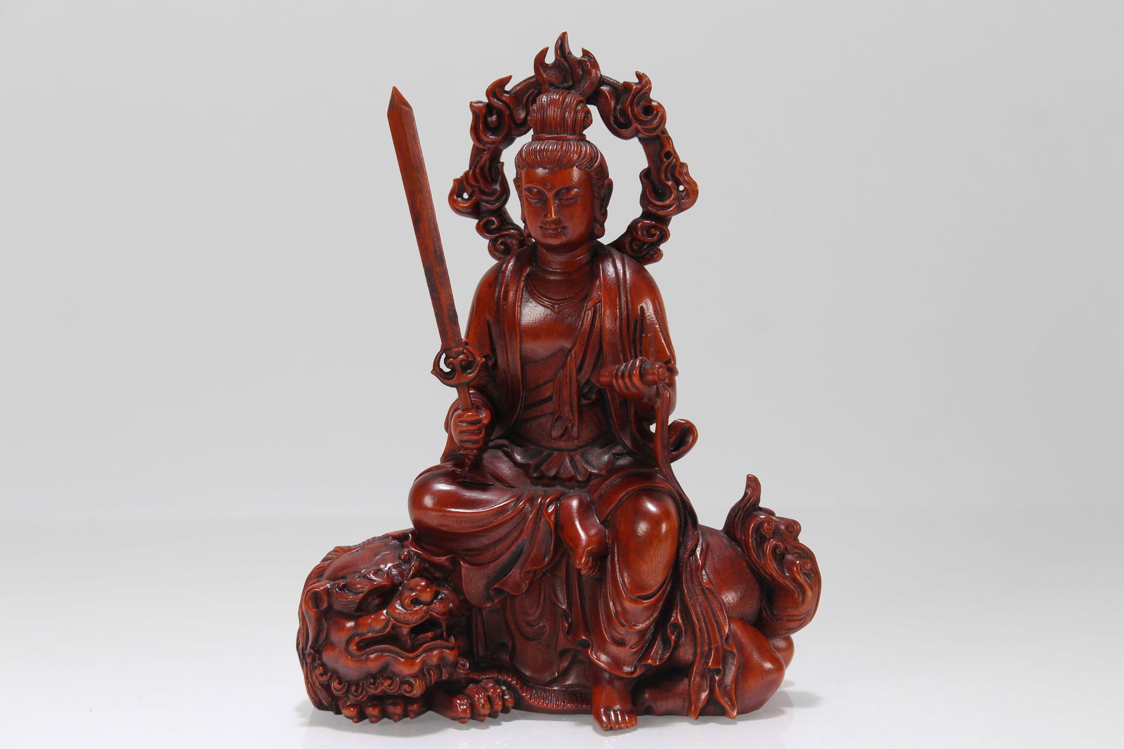 A Chinese Wooden Religious Buddha Statue: A Chinese Wooden Religious Buddha Statue. Height: 5 (inch). Length: 4.25 (inch).
