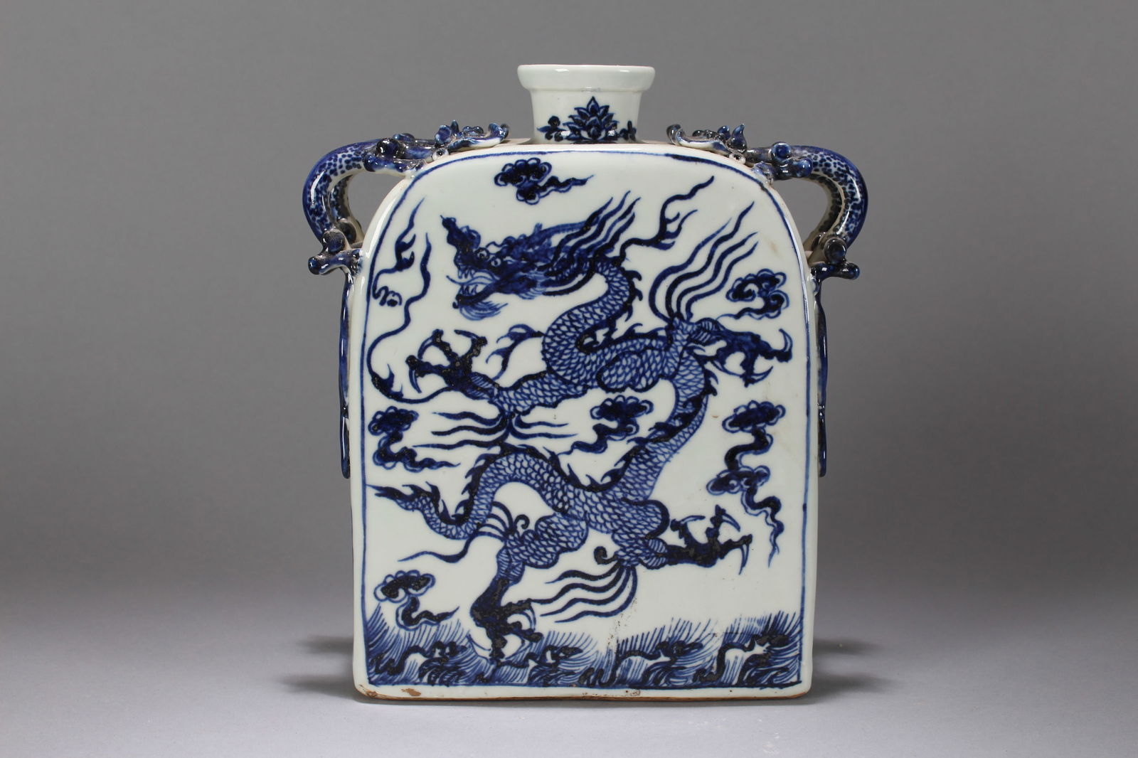 A Chinese Duo-handling Blue and White Dragon-decorating Porcelain Fortune Vase: A Chinese Duo-handling Blue and White Dragon-decorating Porcelain Fortune Vase. Height: 9 (inch). Width: 7.5 (inch). Length: 3 (inch).