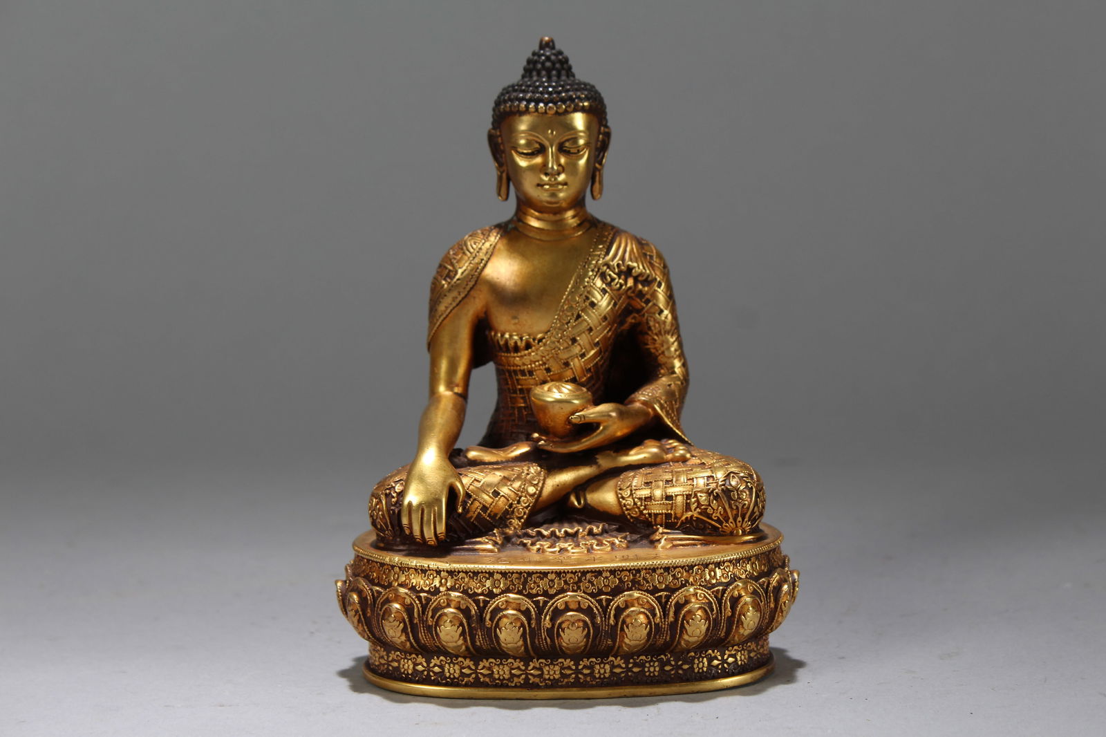A Chinese Gilt Vividly-detailed Religious Fortune Buddha Statue: A Chinese Gilt Vividly-detailed Religious Fortune Buddha Statue. Height: 6 (inch). Width: 4.25 (inch). Length: 3 (inch).