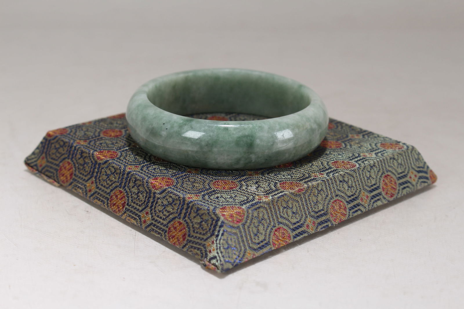 A Chinese Circular Fortune Bracelet: A Chinese Circular Fortune Bracelet. Opening Diameter: 2.75 (inch).