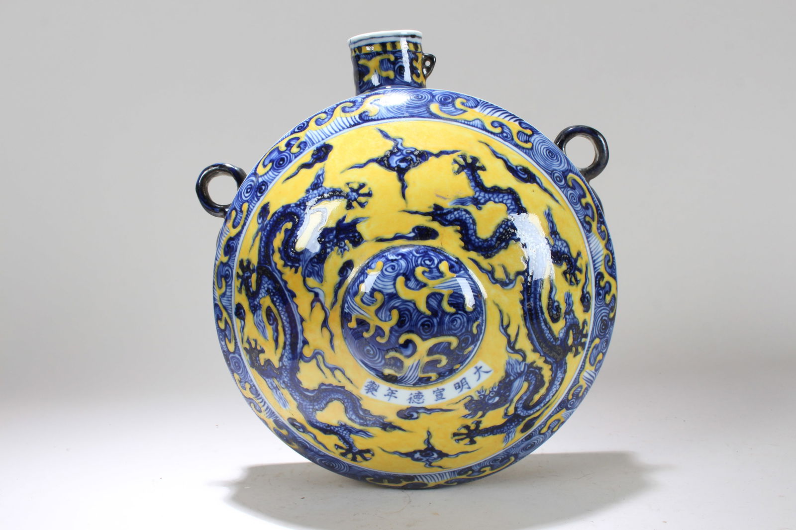 A Chinese Yellow-coding Duo-handled Detailed Dragon-decorating Porcelain Fortune Vase (1 of 4)
