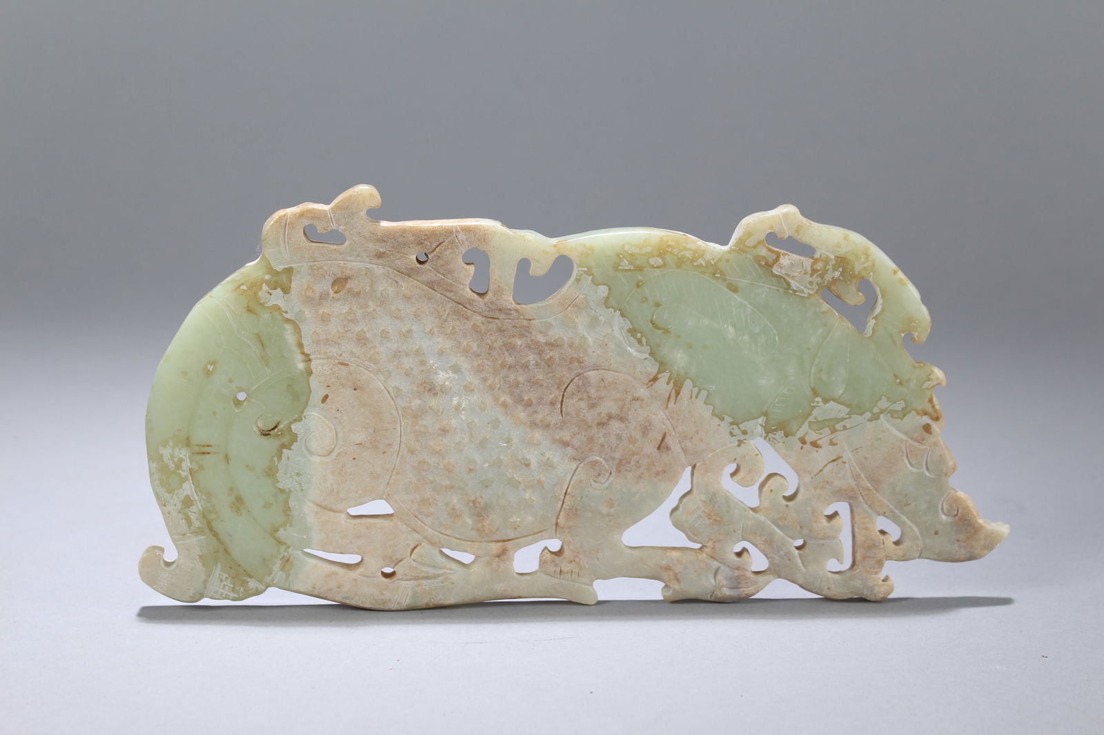 A Chinese Religious Myth-beast Old Jade Figure: A Chinese Religious Myth-beast Old Jade Figure. Height: 0.25 (inch). Length: 8.5 (inch). Width: 4.25 (inch).