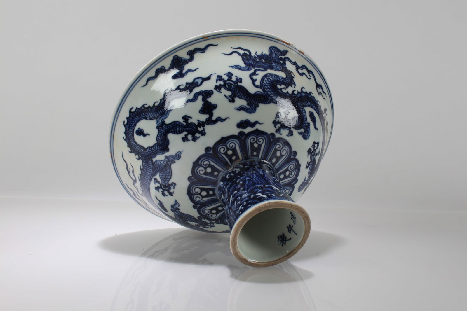 A Chinese Blue and White Porcelain Dragon-decorating Tall-end Cup: A Chinese Blue and White Porcelain Dragon-decorating Tall-end Cup. Height: 6.25 (inch). Width: 9.75 (inch).