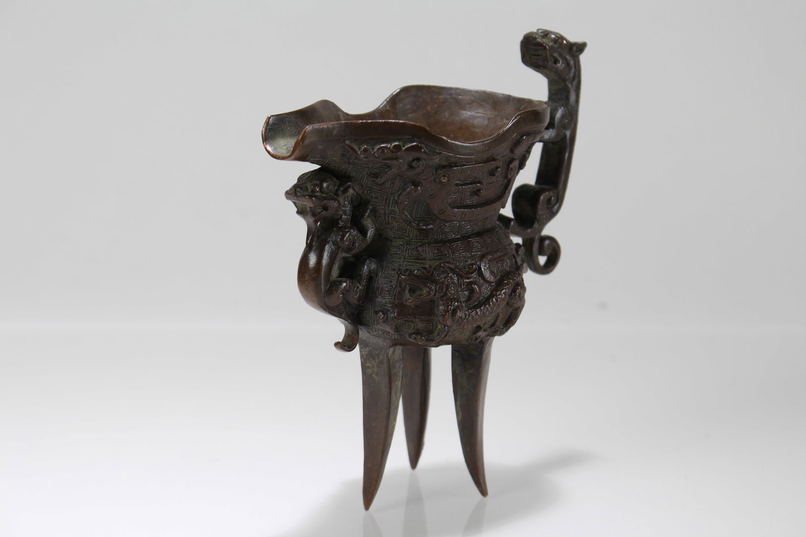 A Chinese Tri-podded Fortune Cup - 2