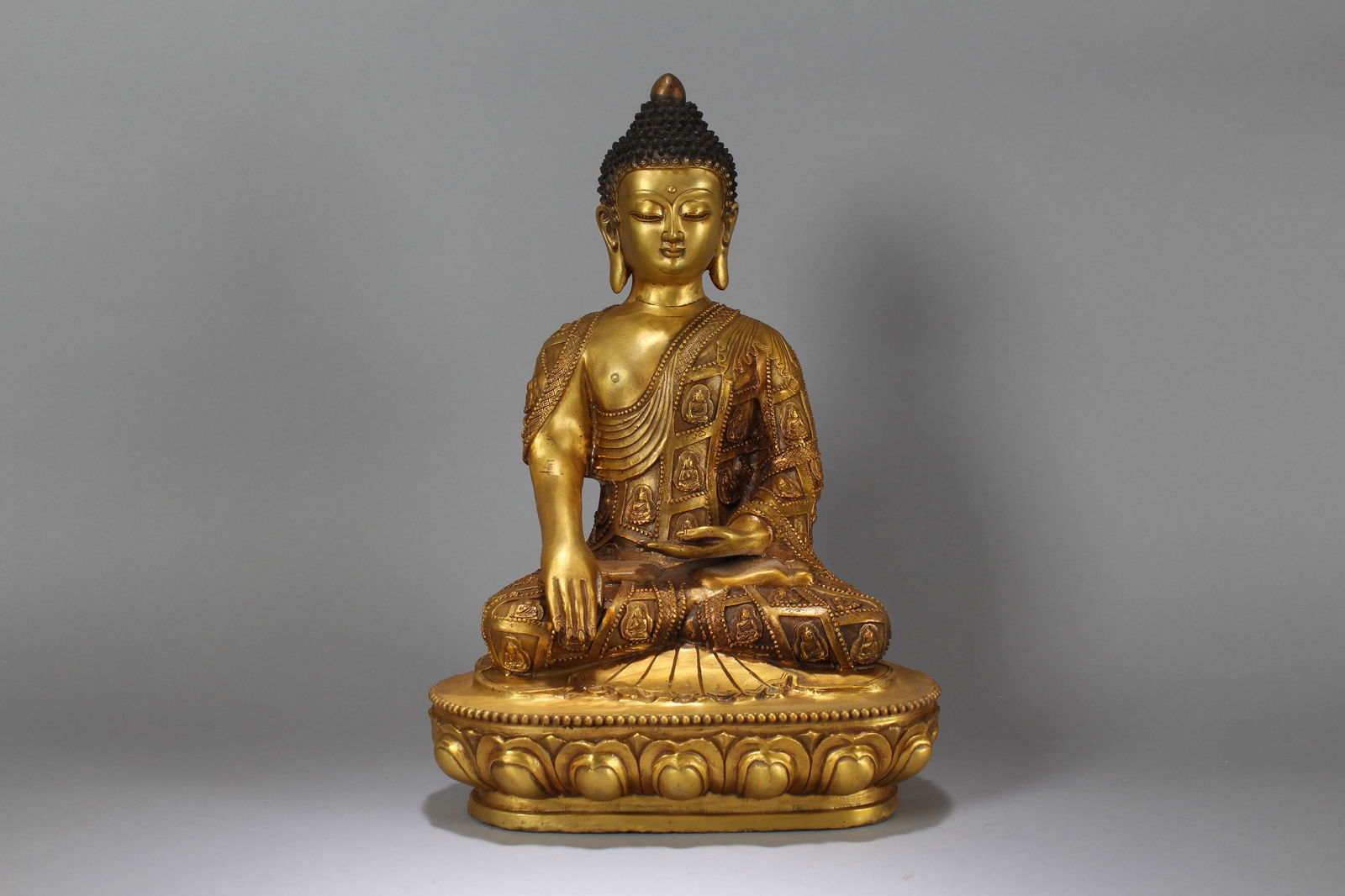 A Chinese Lotus-seated Gilt Fortune Buddha Statue (1 of 8)
