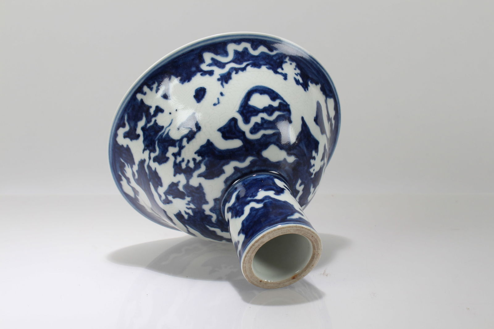 A Chinese Blue and White Porcelain Dragon-decorating Tall-end Cup: A Chinese Blue and White Porcelain Dragon-decorating Tall-end Cup. Height: 4.75 (inch). Width: 6.5 (inch).
