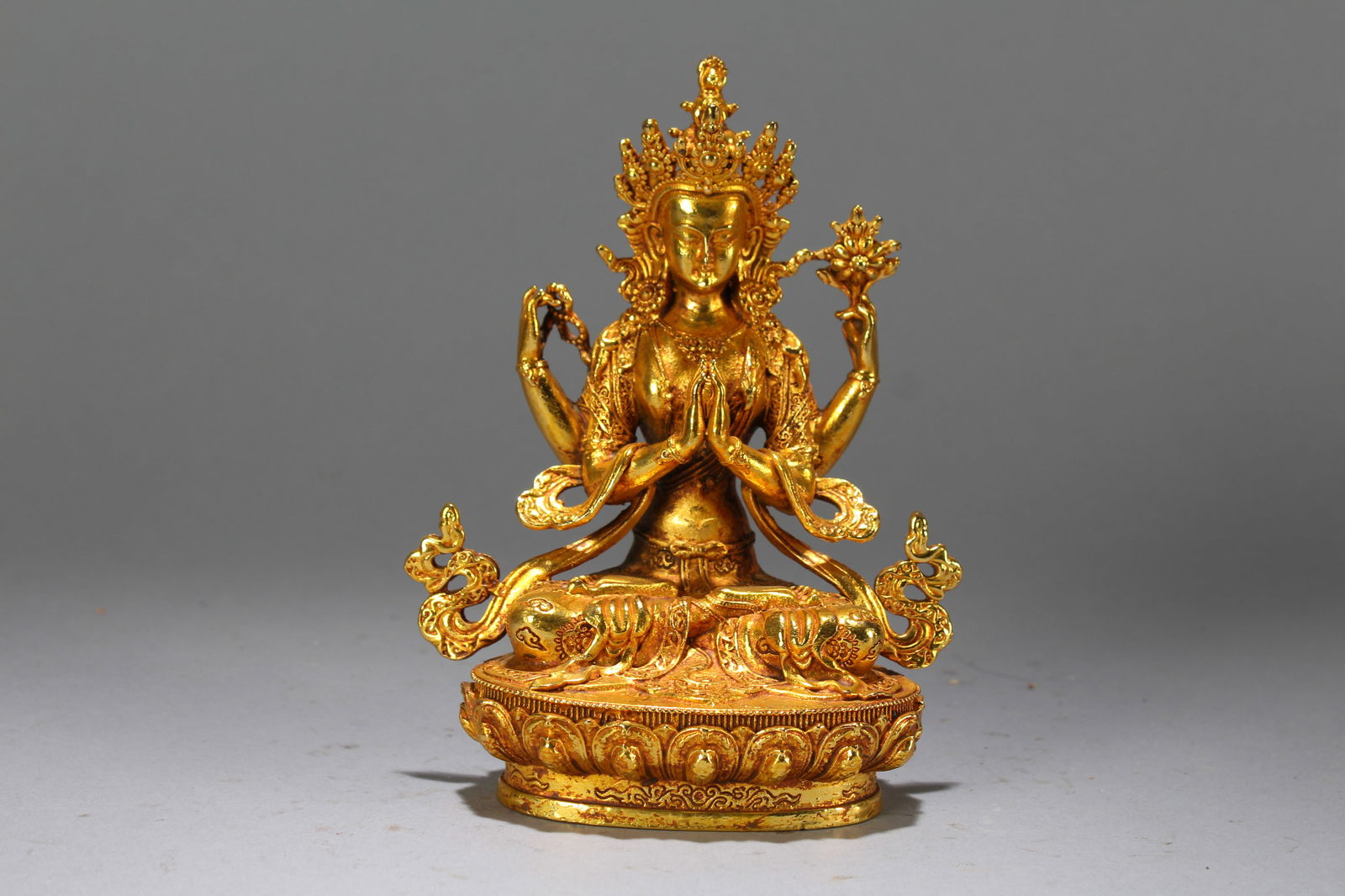 A Chinese Vividly-detailed Gilt Fortune Buddha Statue: A Chinese Vividly-detailed Gilt Fortune Buddha Statue. Height: 6.25 (inch). Length: 4.75 (inch). Width: 2.75 (inch).