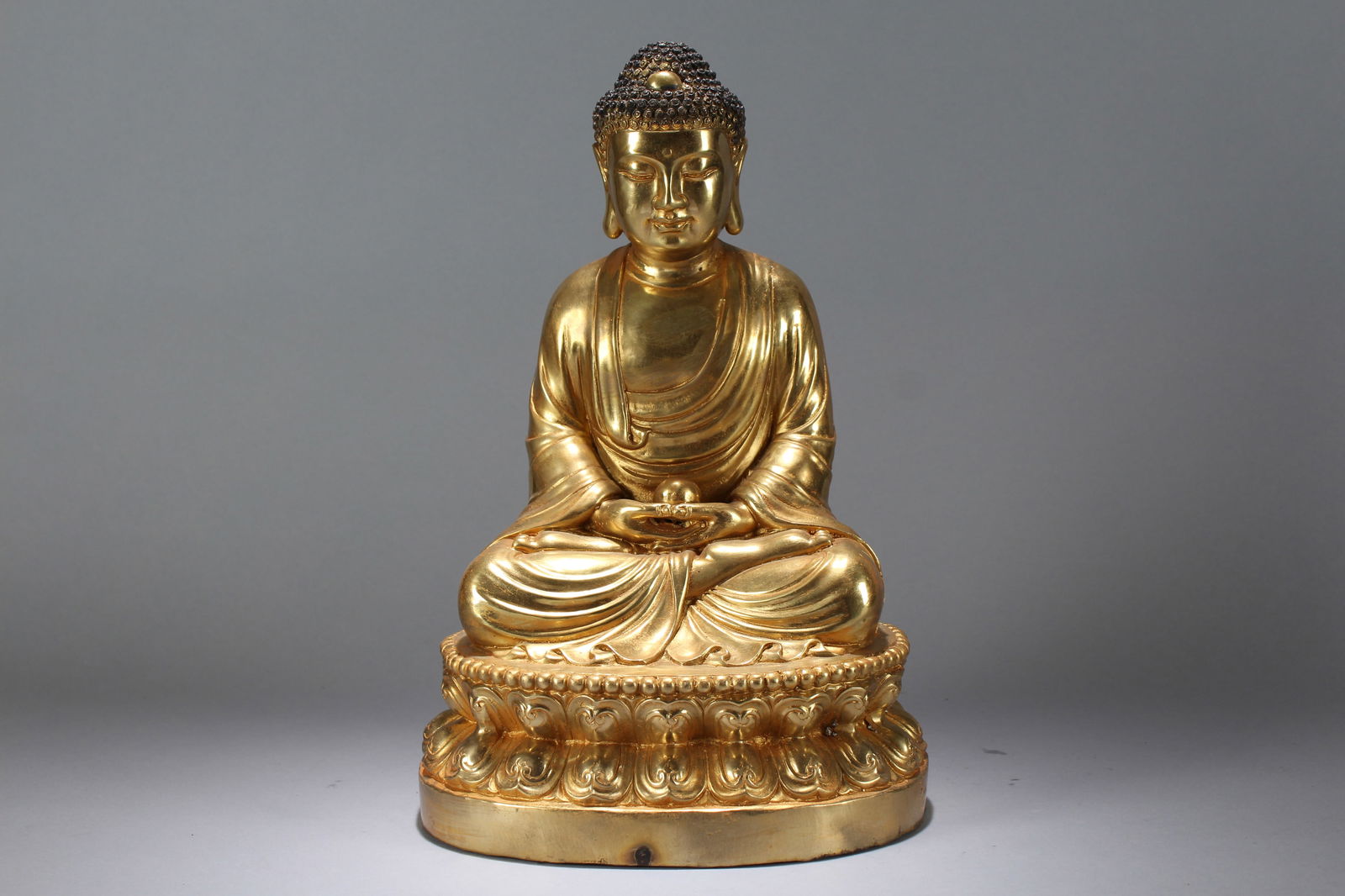 A Chinese Gilt Religious Lotus-seated Fortune Massive Buddha Statue: A Chinese Gilt Religious Lotus-seated Fortune Massive Buddha Statue. Height: 14.5 (inch). Width: 9 (inch). Length: 7 (inch).