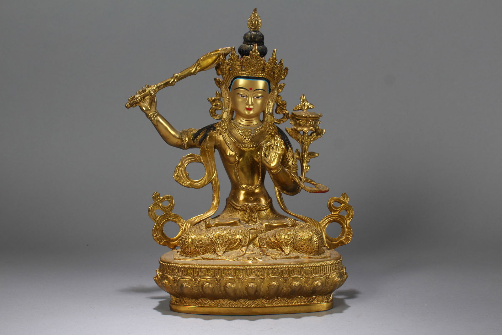 A Chinese Vividly-detailed Religious Gilt Fortune Buddha Statue: A Chinese Vividly-detailed Religious Gilt Fortune Buddha Statue. Height: 11.5 (inch). Length: 8.25 (inch). Width: 4.5 (inch).