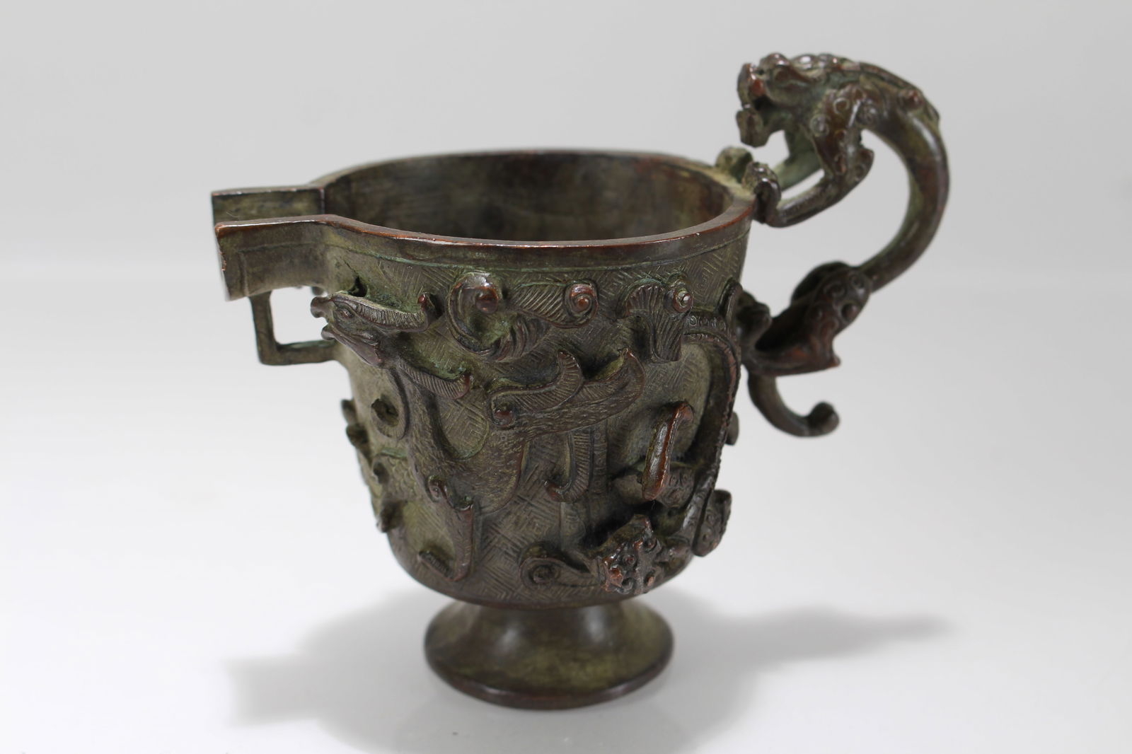 A Chinese Anicent-framing Fortune Cup: A Chinese Anicent-framing Fortune Cup. Height: 4 (inch). Length: 4.5 (inch).