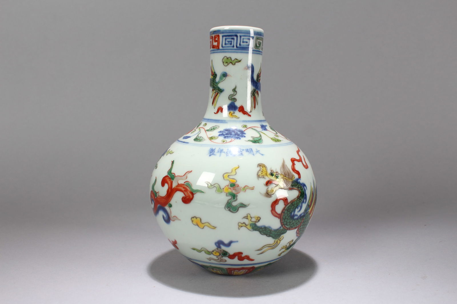 A Chinese Dragon-decorating Porcelain Fortune Vase: A Chinese Dragon-decorating Porcelain Fortune Vase. Height: 7.75 (inch). Width: 5.5 (inch).