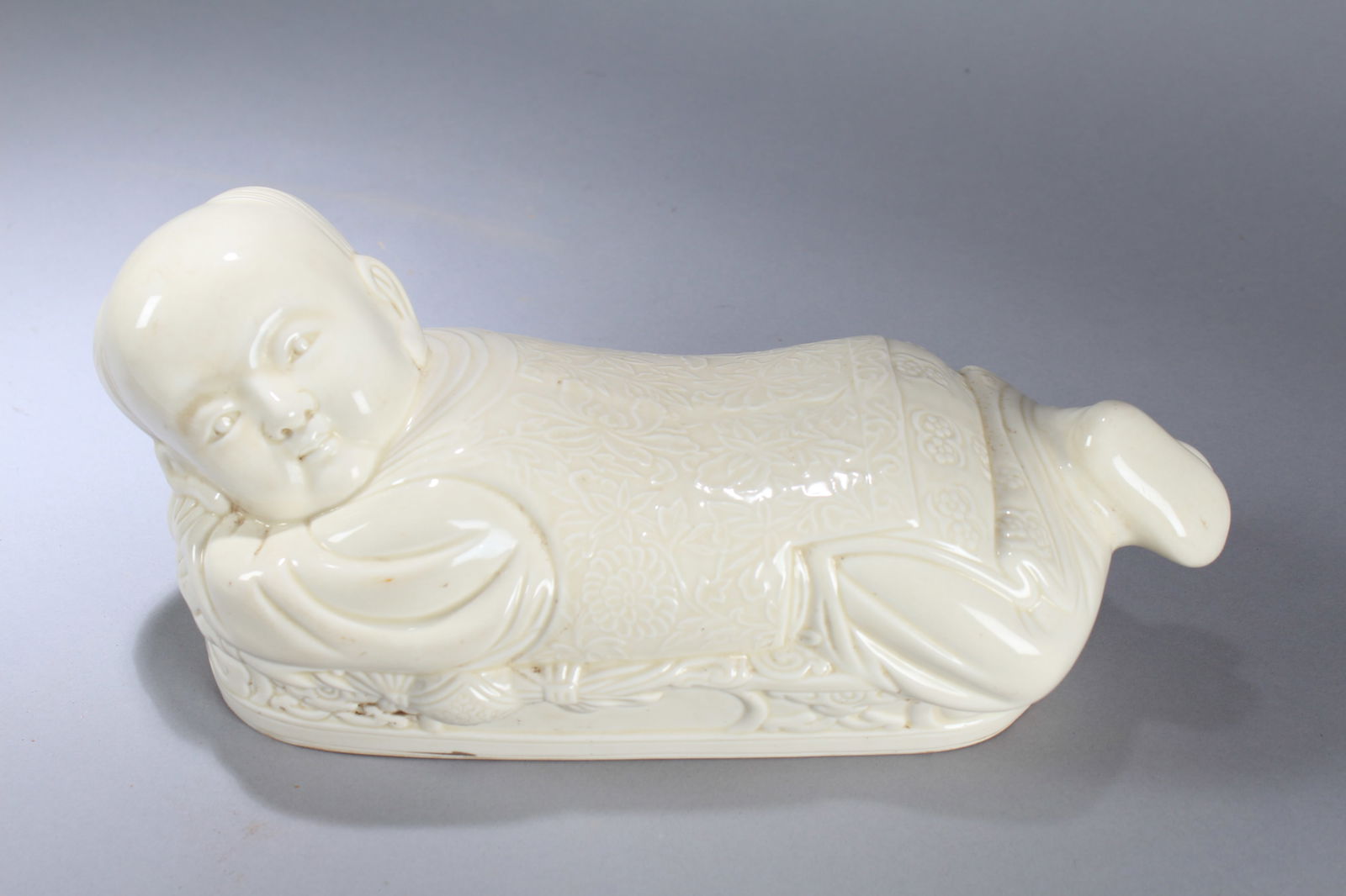 A Chinese Religious Porcelain Fortune Pillow Stand: A Chinese Religious Porcelain Fortune Pillow Stand. Height: 6 (inch). Width: 14 (inch). Length: 5 (inch)