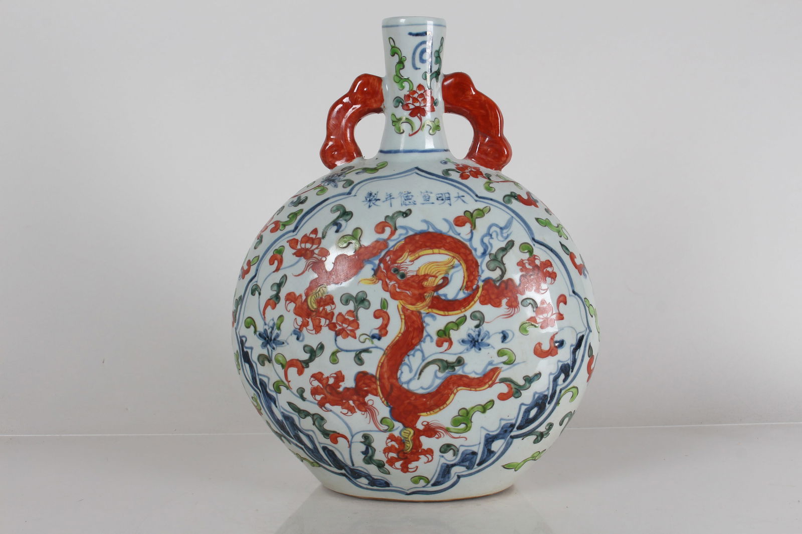 A Chinese Dragon-decorating Duo-handled Porcelain Fortune Vase: A Chinese Dragon-decorating Duo-handled Porcelain Fortune Vase . Height: 13.25 (inch).