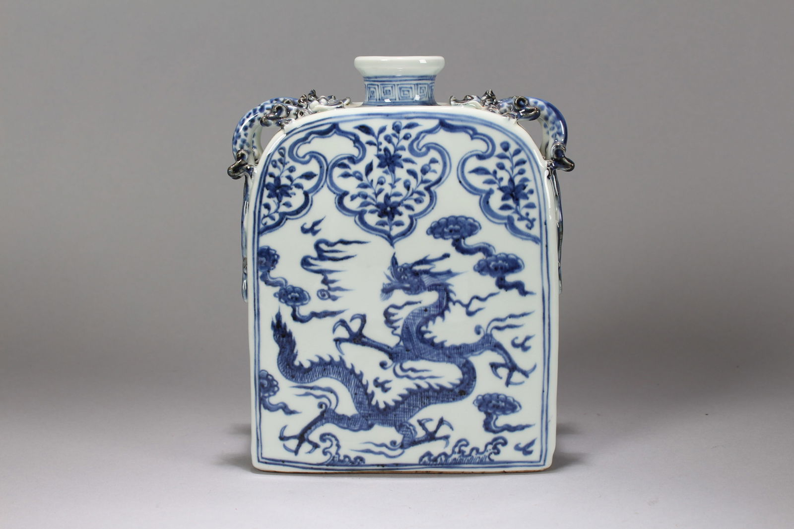A Chinese Duo-handling Blue and White Dragon-decorating Porcelain Vase: A Chinese Duo-handling Blue and White Dragon-decorating Porcelain Vase. Height: 9 (inch). Width: 6.5 (inch). Length: 3 (inch).