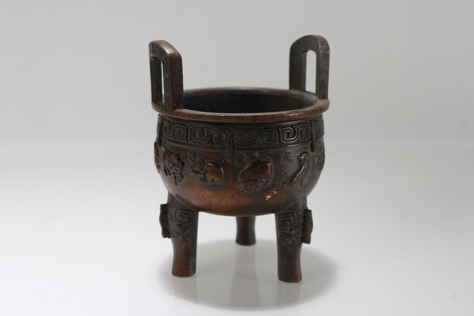 A Chinese Duo-handled Tri-podded Fortune Censer: A Chinese Duo-handled Tri-podded Fortune Censer . Height: 3.75 (inch). Opening Diamater: 2.75 (inch).