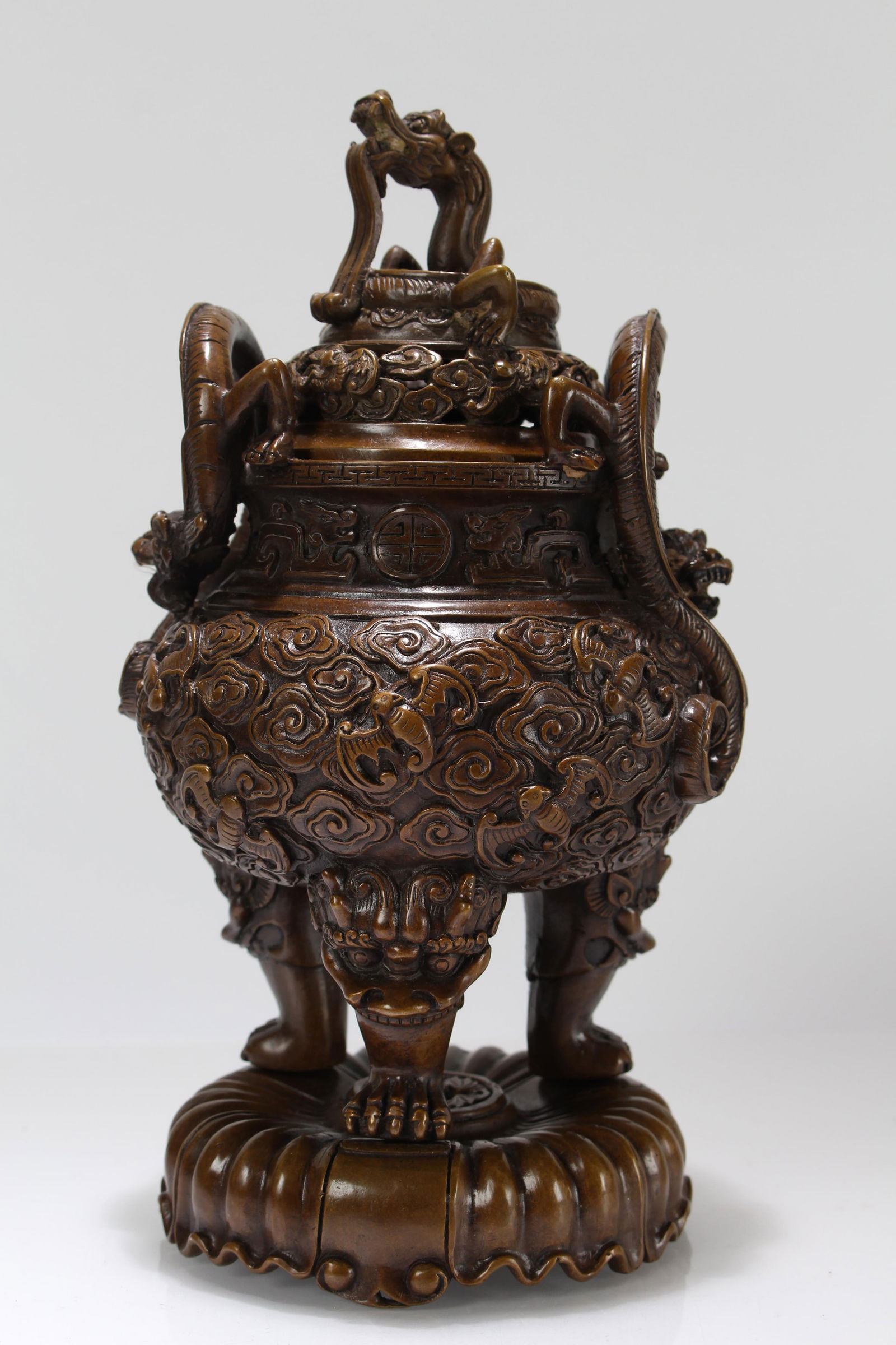 A Chinese Vividly-detailed Duo-handling Tri-podded Lidded Fortune Censer: A Chinese Vividly-detailed Duo-handling Tri-podded Lidded Fortune Censer. Height: 10.5 (inch).