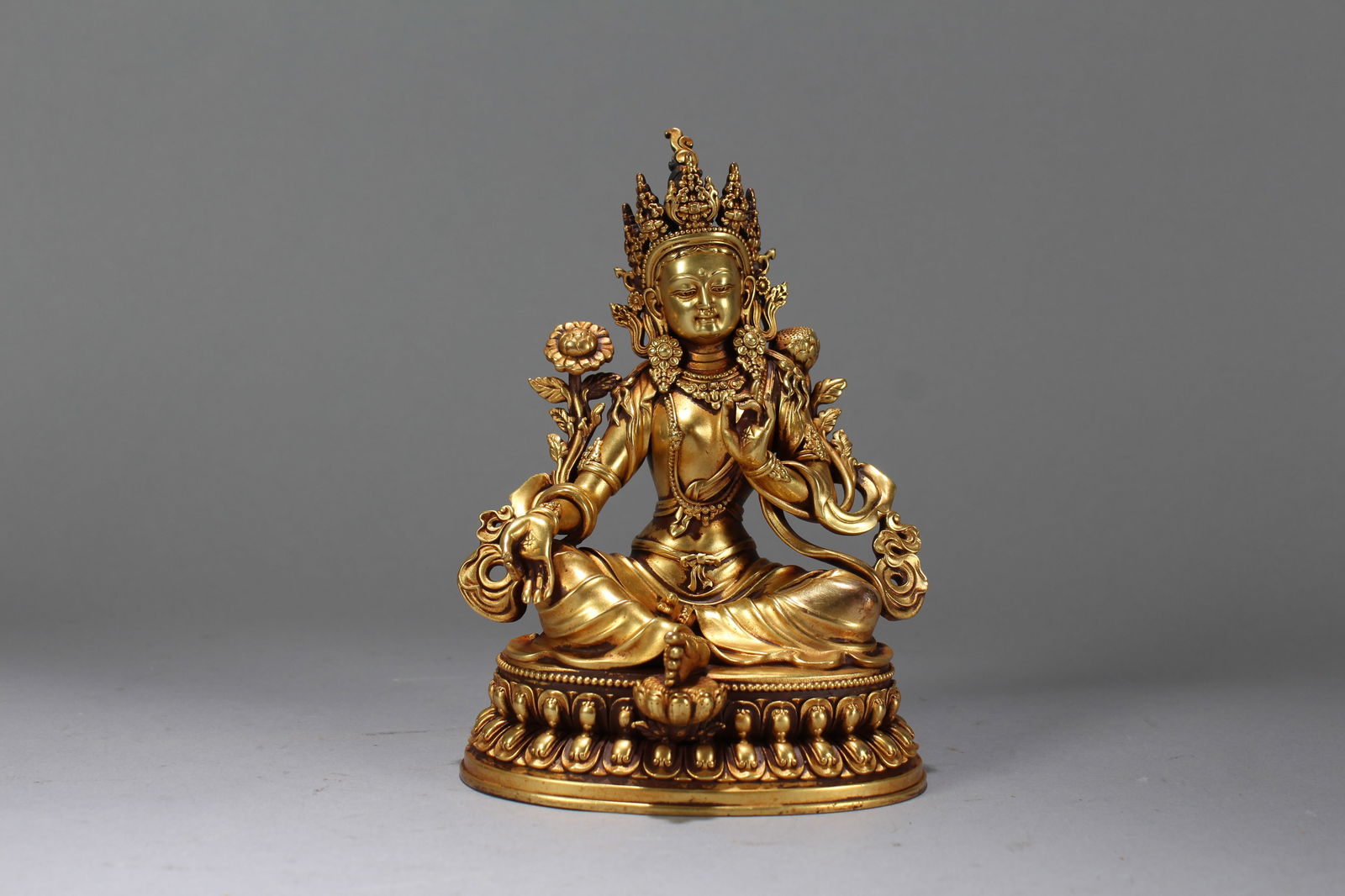 A Chinese Gilt Vividly-detailed Religious Fortune Buddha Statue: A Chinese Gilt Vividly-detailed Religious Fortune Buddha Statue. Height: 6.25 (inch). Width: 4.5 (inch). Length: 3.5 (inch).