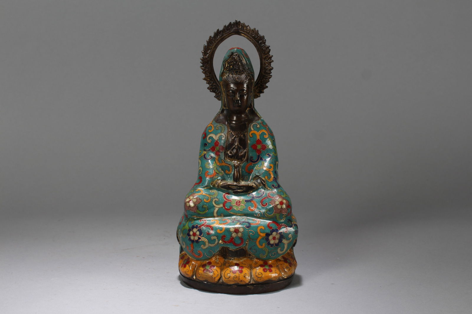 A Chinese Cloisonne Bat-framing Religious Fortune Buddha Statue: A Chinese Cloisonne Bat-framing Religious Fortune Buddha Statue. Height: 9.75 (inch). Length: 4.25 (inch). Width: 3.5 (inch).