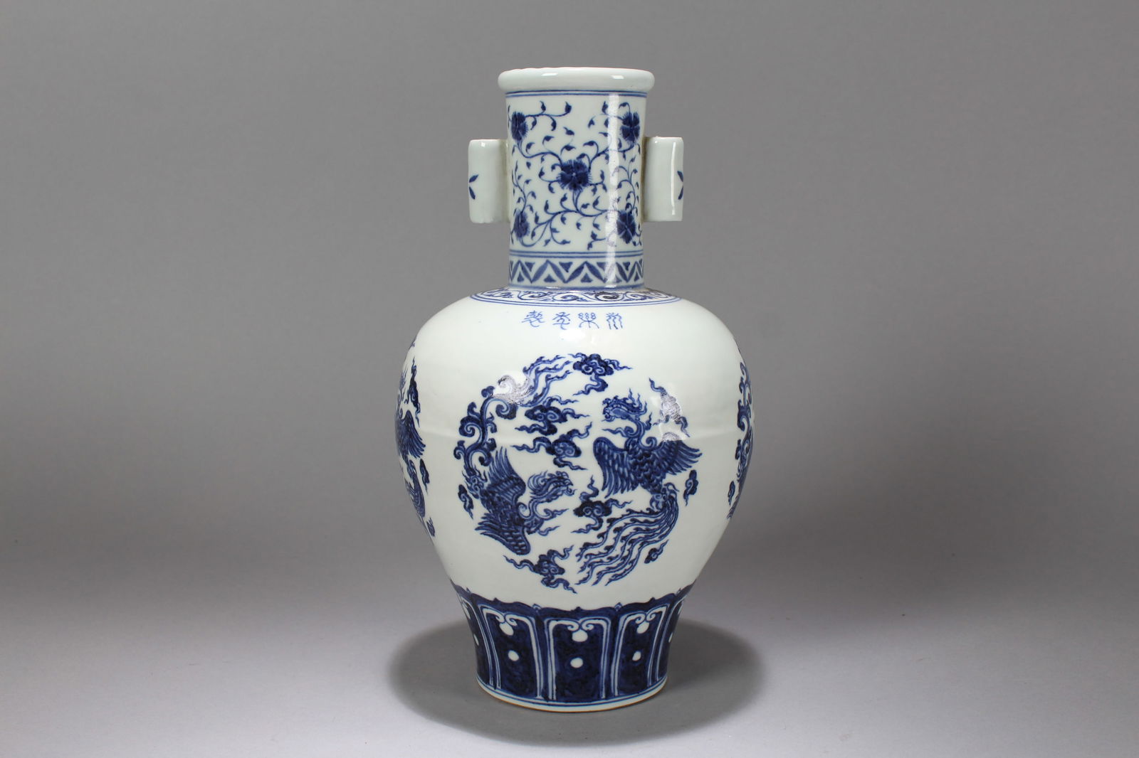 A Chinese Duo-handling Blue and White Dragon-phoenix Religious Porcelain Vase: A Chinese Duo-handling Blue and White Dragon-phoenix Religious Porcelain Vase. Height: 12 (inch). Width: 6 (inch).