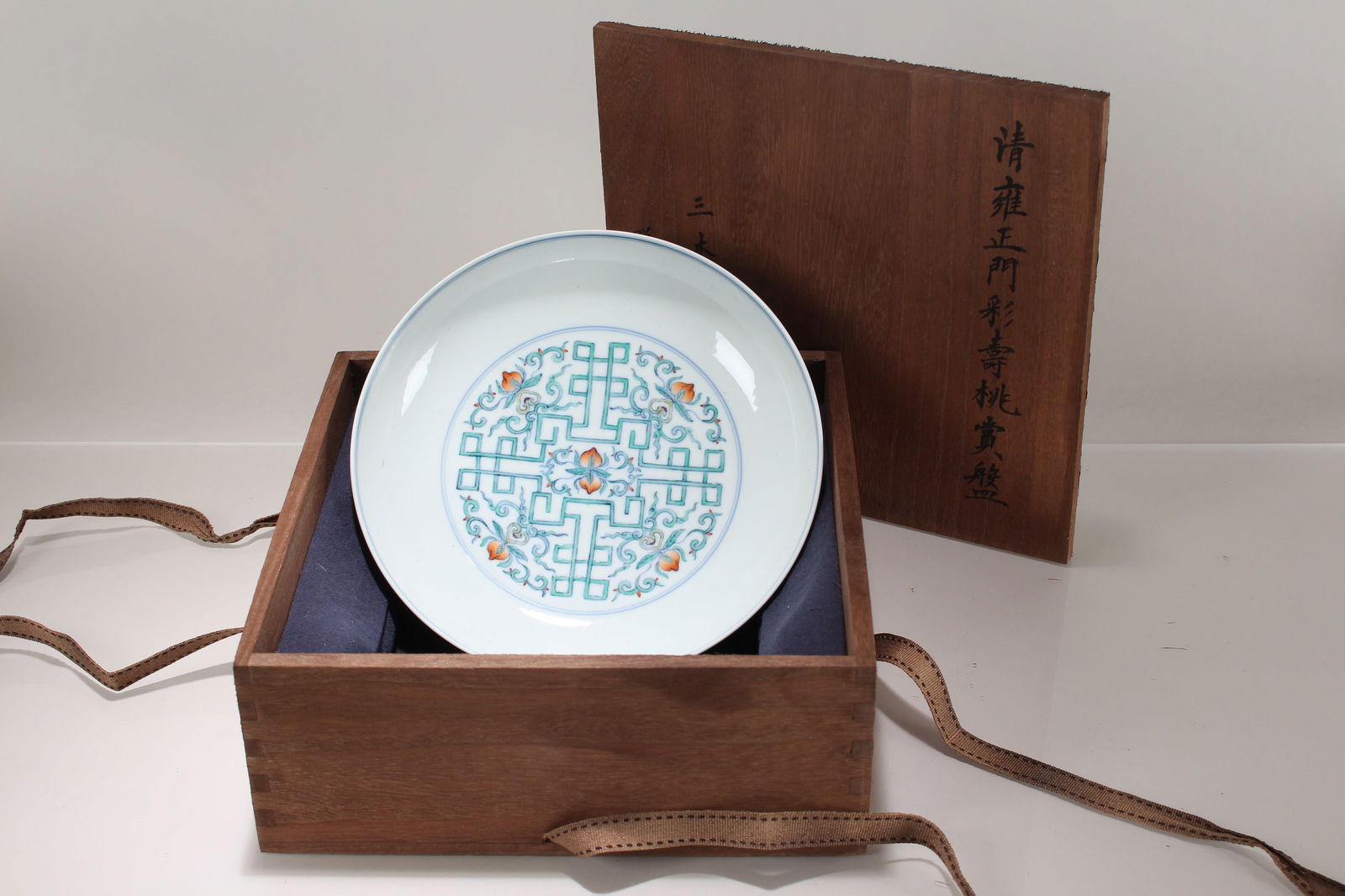 A Chinese Wooden-boxed Porcelain Anicent-framing Fortune Plate: A Chinese Wooden-boxed Porcelain Anicent-framing Fortune Plate. Height: 1.75 (inch). Opening Diameter: 8.25 (inch)