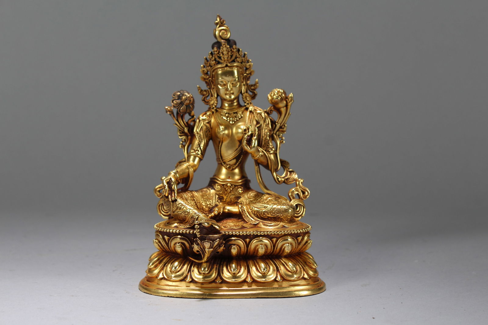 A Chinese Gilt Vividly-detailed Religious Fortune Buddha Statue: A Chinese Gilt Vividly-detailed Religious Fortune Buddha Statue. Height: 6.25 (inch). Width: 4.25 (inch). Length: 3 (inch).