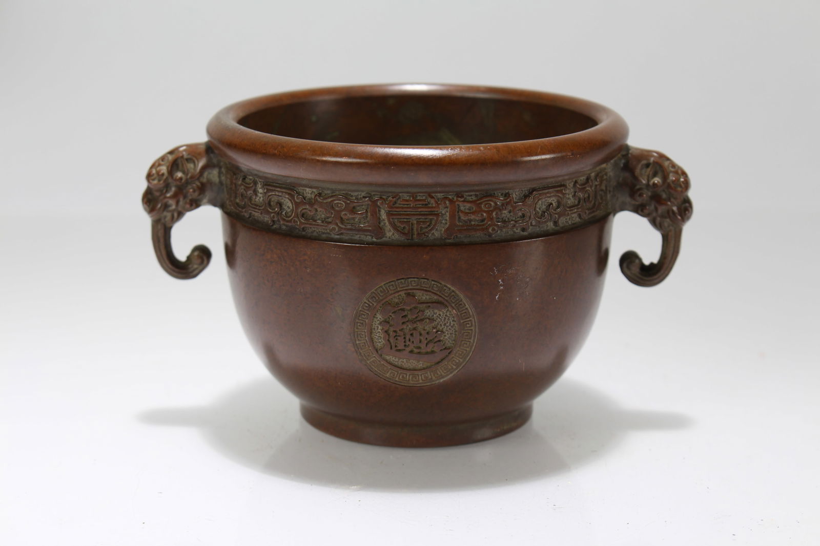 A Chinese Duo-handling Lidded Wealth-Fortune-icon Censer: A Chinese Duo-handling Lidded Wealth-Fortune-icon Censer. Height: 3 (inch). Length: 5 (inch).