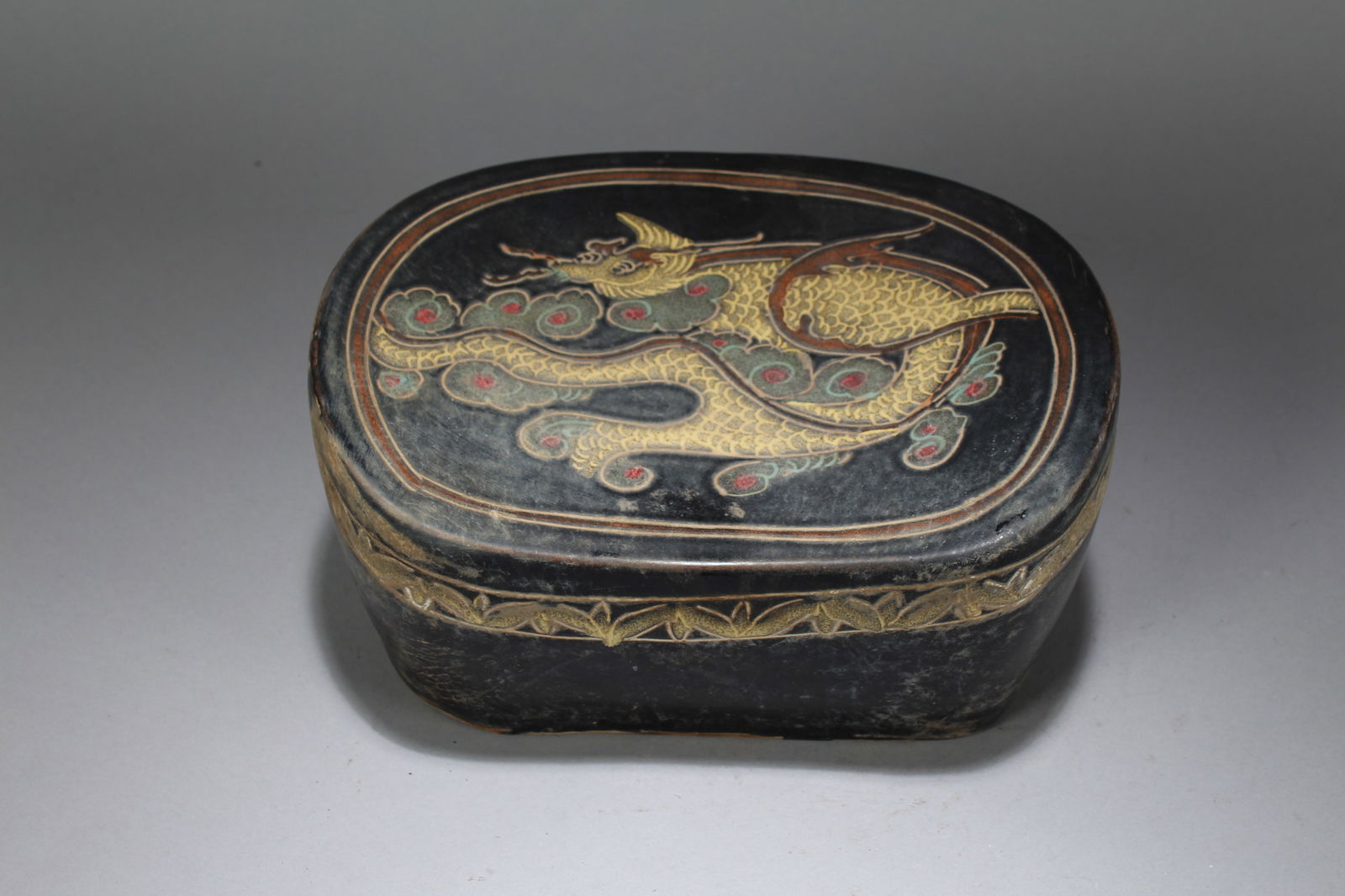 A Chinese Dragon-decorating Porcelain Fortune Statue: A Chinese Dragon-decorating Porcelain Fortune Statue. Height: 4 (inch). Width: 9.5 (inch). Length: 7 (inch).